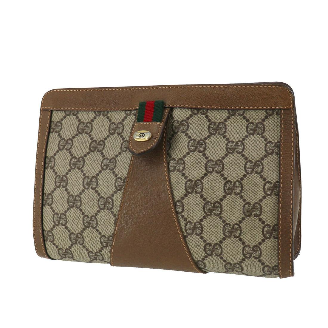 Authentic GUCCI Clutch: Brand: GUCCI Model: Clutch Country of Origin: Italy Material: Leather Color: Brown Bag Length: 9.0 Bag Height: 5.9 Bag Depth: 2.5 All Bidhaus items come with a 100 % money-back authenticity guarantee.
