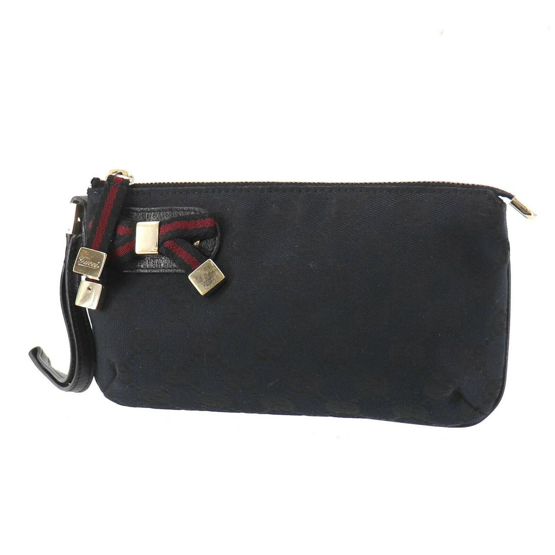 Authentic GUCCI Pouch: Brand: GUCCI Model: Pouch Country of Origin: Italy Material: Canvas Color: Gold Size (inch): small All Bidhaus items come with a 100 % money-back authenticity guarantee. ALL SALES ARE FINAL. Please re