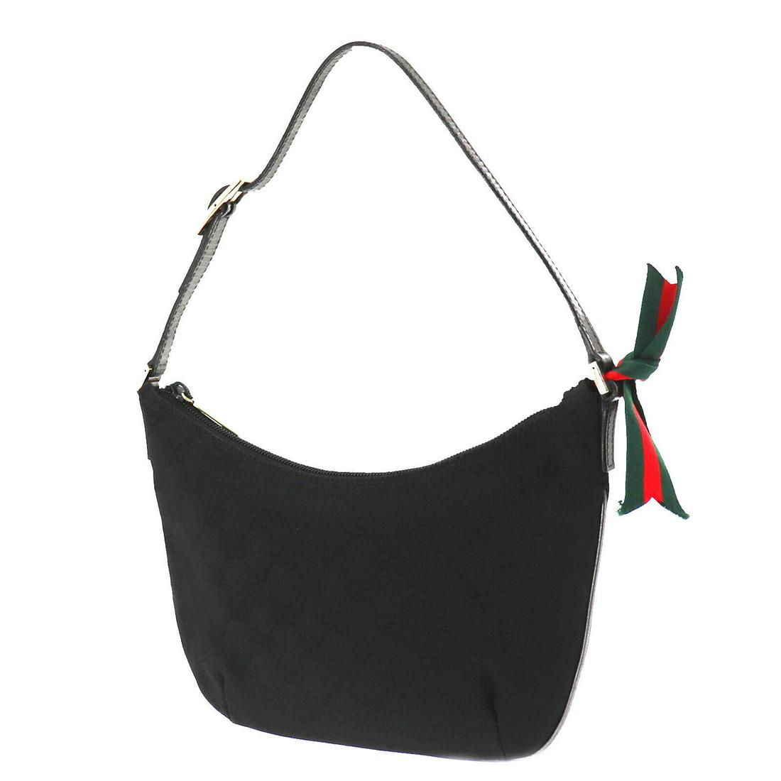 Authentic GUCCI Hand Bag: Brand: GUCCI Model: Hand Bag Country of Origin: Italy Material: Nylon Color: Gold Size (inch): small All Bidhaus items come with a 100 % money-back authenticity guarantee. ALL SALES ARE FINAL. Please 