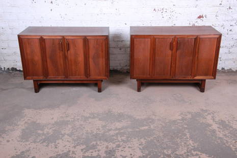 Lawrence Peabody Mid-Century Modern Walnut Cabinets or: A sleek pair of mid-century modern walnut credenzas or oversized nightstands Designed by Lawrence Peabody for Richardson Nemschoff USA 1960s Book-matched walnut + sculpted solid walnut handles and leg