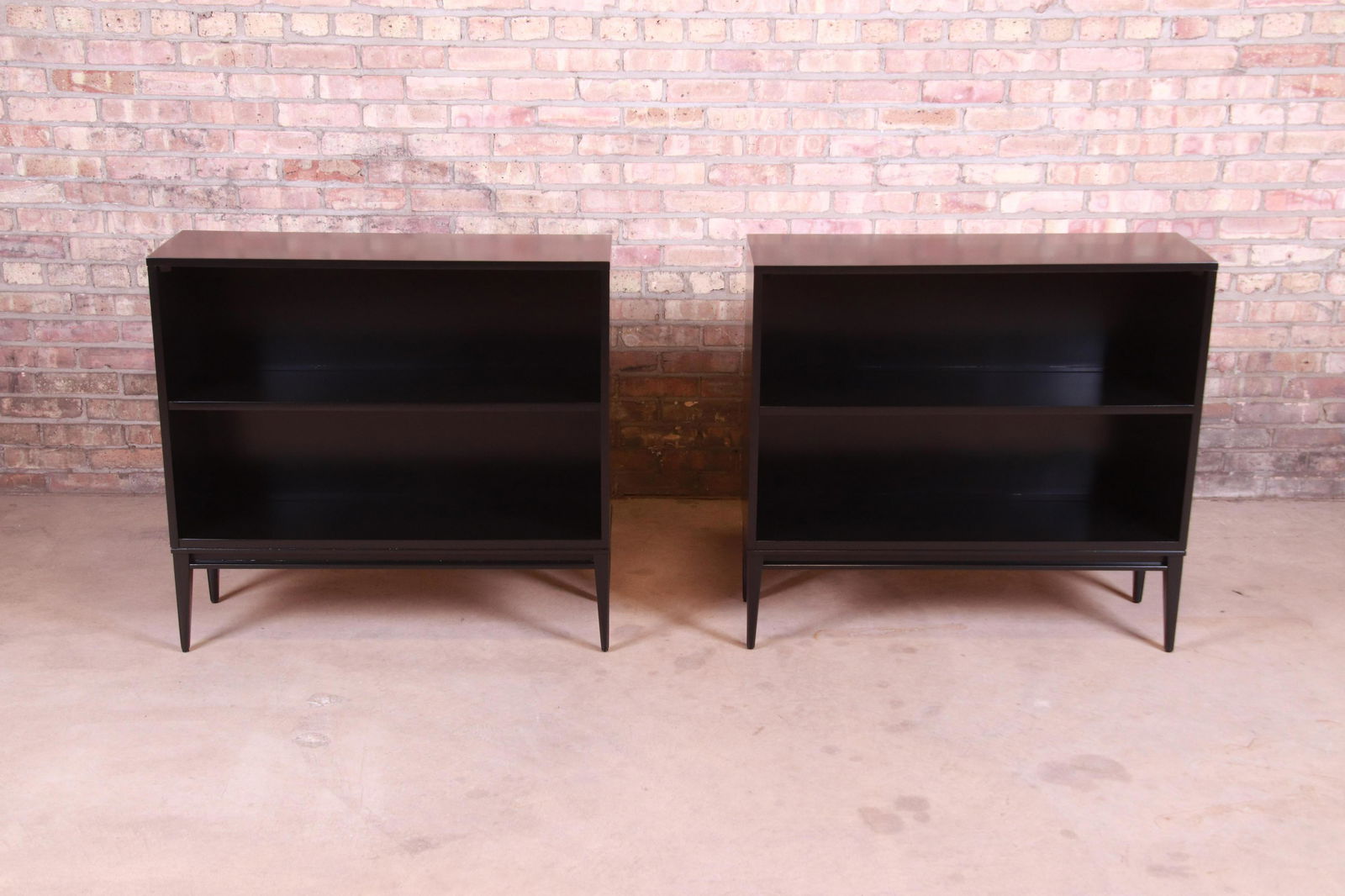 Paul McCobb Planner Group Mid-Century Modern Black: An exceptional pair of mid-century modern black lacquered solid birch bookcases By Paul McCobb for Winchendon Furniture "Planner Group" USA 1950s Measures: 36"W x 12.13"D x 33.5"H. Newly refinished. E
