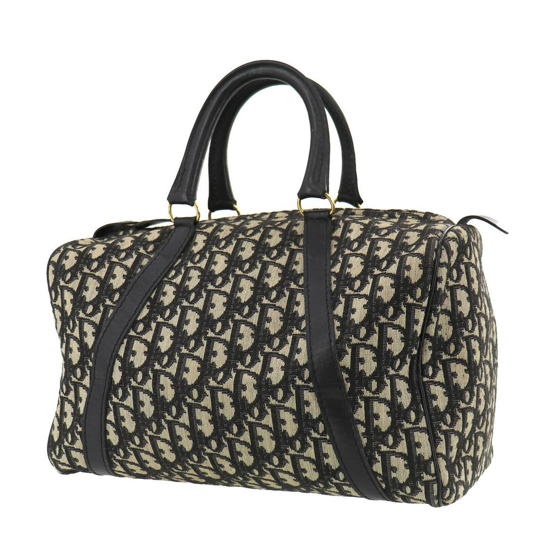 Authentic CHRISTIAN DIOR Boston Bag: Brand: CHRISTIAN DIOR Model: Boston Bag Country of Origin: France Material: Leather Color: Black Silver Bag Length: 12.9 Bag Height: 7.4 Bag Depth: 6.6 All Bidhaus items come with a 100 % money-back a