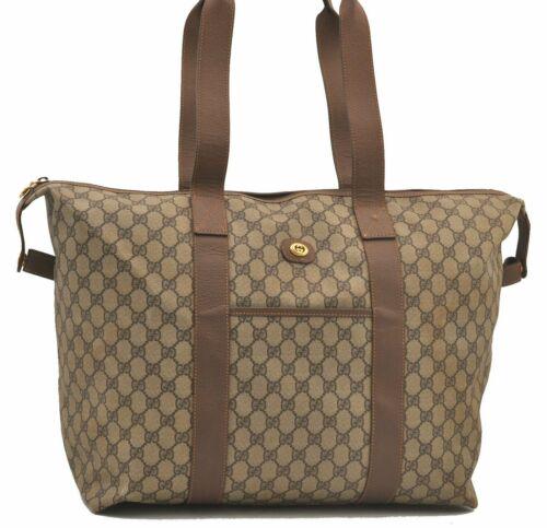 Authentic GUCCI Travel Bag: Brand: GUCCI Model: Travel Bag Country of Origin: Italy Material: PVC Color: Brown Bag Length: 15.9inches (40.5cm) Bag Height: 13inches (33cm) Bag Depth: 7.5inches (19cm) All Bidhaus items come with a
