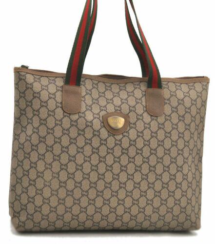 Authentic GUCCI Tote Bag: Brand: GUCCI Model: Tote Bag Country of Origin: Italy Material: PVC Color: Brown Bag Length: 14.2inches (36cm) Bag Height: 12inches (30.5cm) Bag Depth: 3.5inches (9cm) All Bidhaus items come with a 10