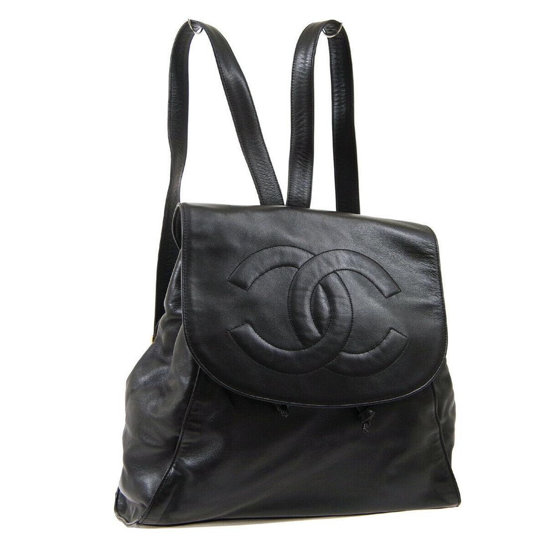 Authentic CHANEL Backpack Bag: Brand: CHANEL Model: Backpack Bag Country of Origin: Italy Material: Nylon Color: Black Size (Inch): W 11.8 x H 11.8 x D 3.7 " Strap total length. 29.9 " Size (CM): W 30.0 x H 30.0 x D 9.5 cm Strap to