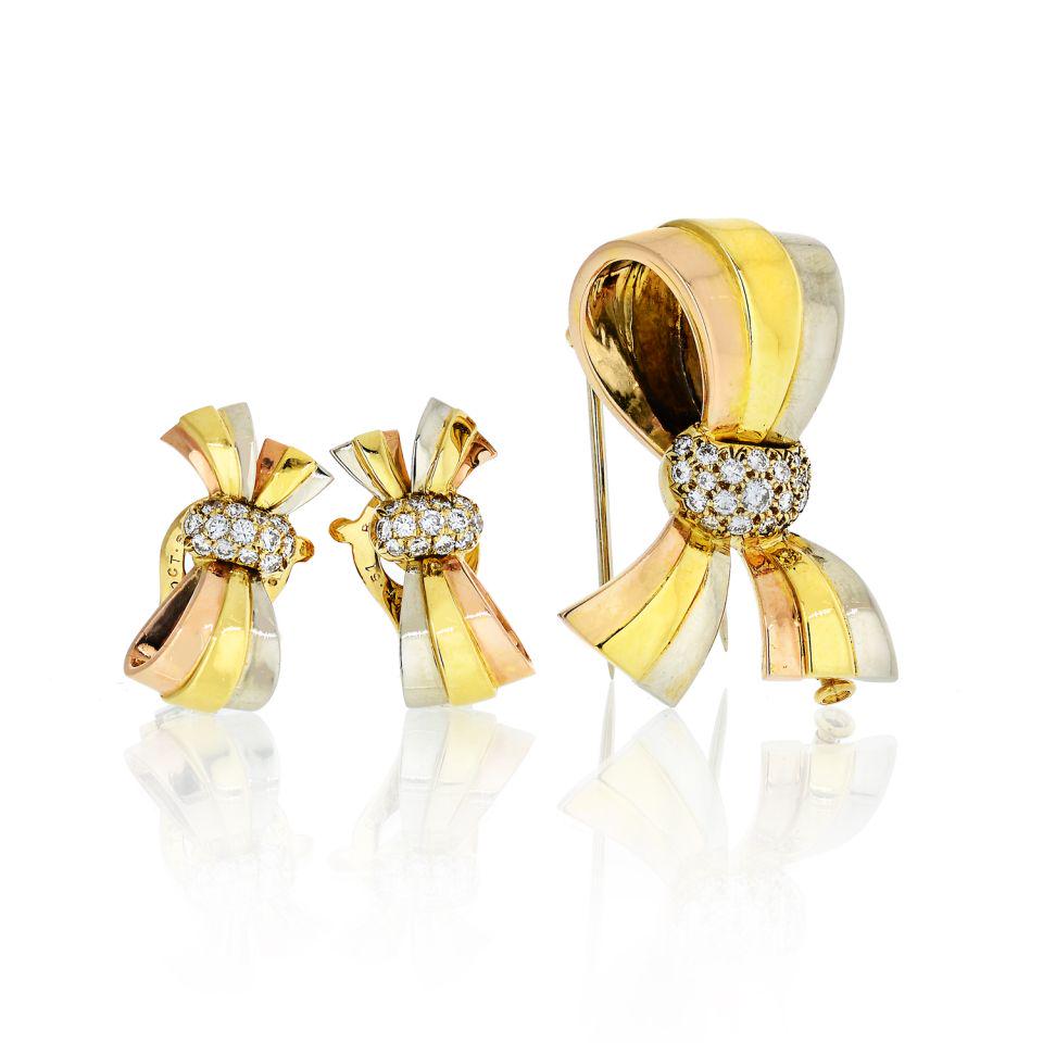 Authentic Van Cleef & Arpels Van Cleef & Arpels Bow: Type: Vintage Jewelry Brand: Van Cleef & Arpels Metal: 18K Tri Color Grams: 22.4 Exact Diamond Weight: 0.5 Cts Other Details: Gold set of bow earrings and a brooch in 18k tri color gold by Van Cleef &