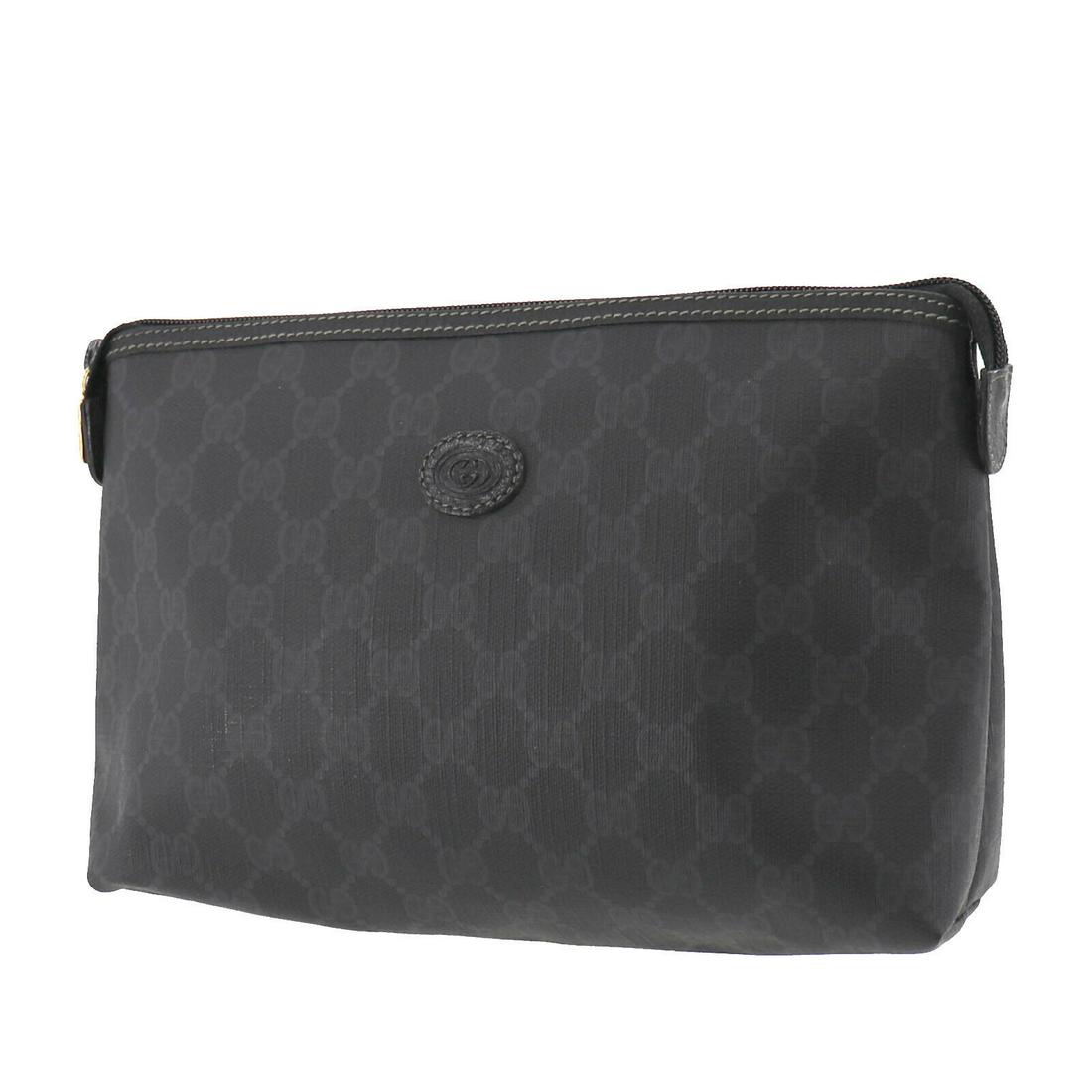 Authentic GUCCI Pouch: Brand: GUCCI Model: Pouch Country of Origin: Italy Material: Canvas Color: Gold Bag Length: 10.6 Bag Height: 6.6 Bag Depth: 2.9 All Bidhaus items come with a 100 % money-back authenticity guarantee. A