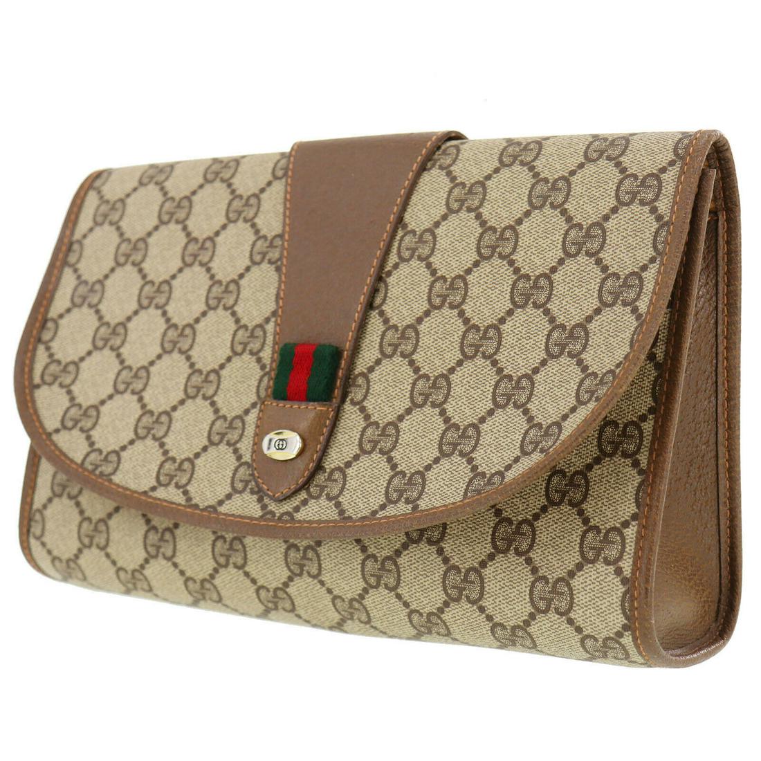 Authentic GUCCI Clutch: Brand: GUCCI Model: Clutch Country of Origin: Italy Material: Leather Color: Gold Bag Length: 9.8 Bag Height: 6.2 Bag Depth: 2.7 All Bidhaus items come with a 100 % money-back authenticity guarantee. 