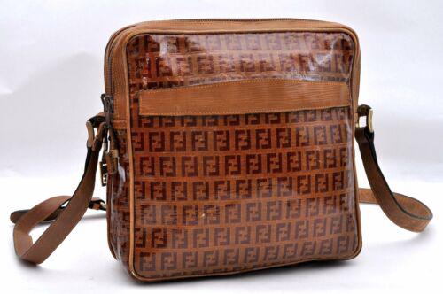 Authentic FENDI Shoulder Bag: Brand: FENDI Model: Shoulder Bag Country of Origin: Material: Vinyl Color: Brown Bag Length: 8.9inches (22.5cm) Bag Height: 9.1inches (23cm) Bag Depth: 3.1inches (8cm) All Bidhaus items come with a 10