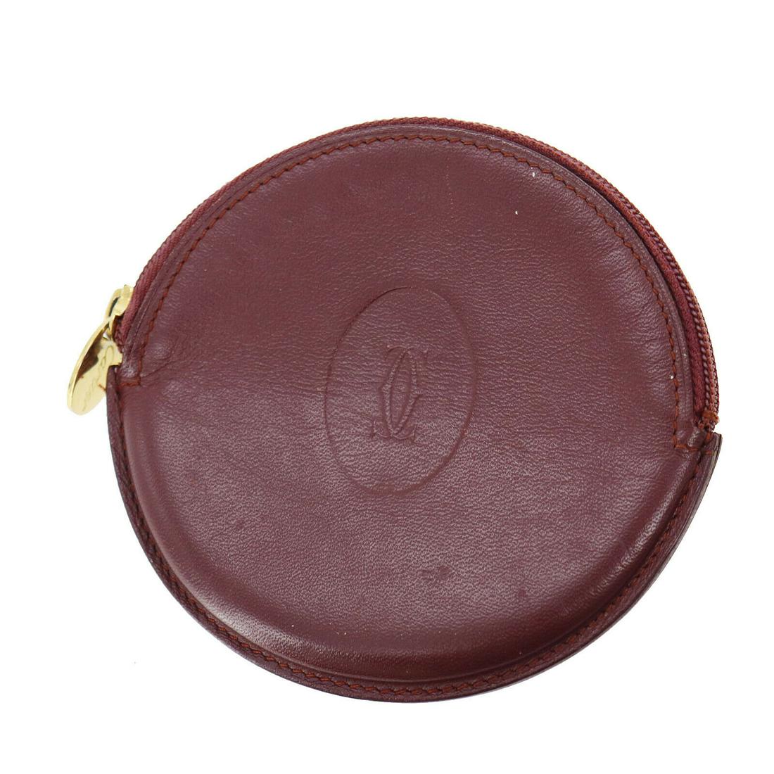 Authentic CARTIER Coin Case: Brand: CARTIER Model: Coin Case Country of Origin: Spain Material: Leather Color: Bordeaux All Bidhaus items come with a 100 % money-back authenticity guarantee. ALL SALES ARE FINAL. Please refer to i