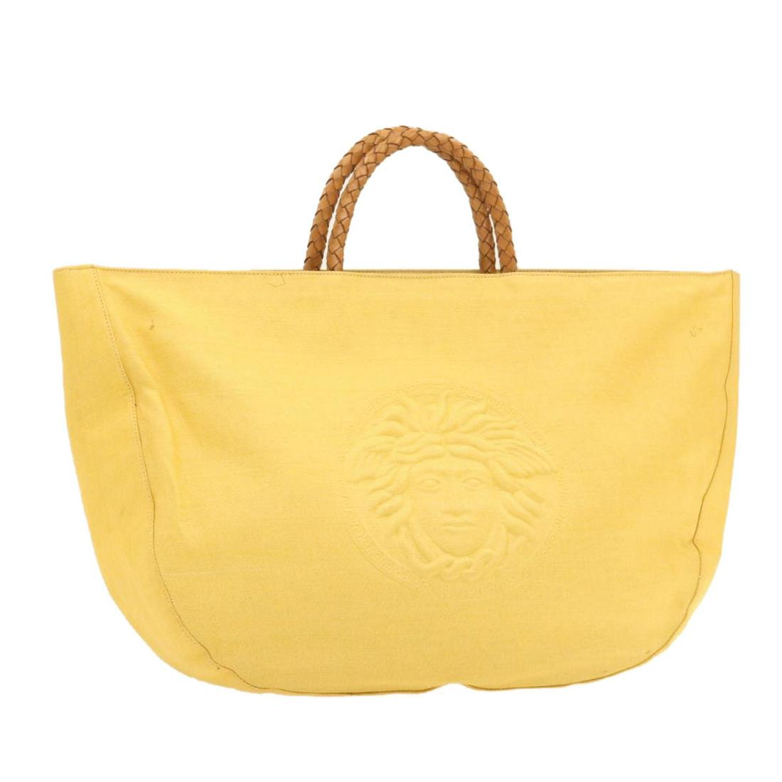 Authentic GIANNI VERSACE Canvas Hand Bag: Brand: GIANNI VERSACE Material: Canvas Style: Hand Bag Color: Yellow Size(inch): W18.5 x H12.59 x D4.33inch(Approx) Country of Origin: - Accessory: There is no item box and dust bag. We will send only