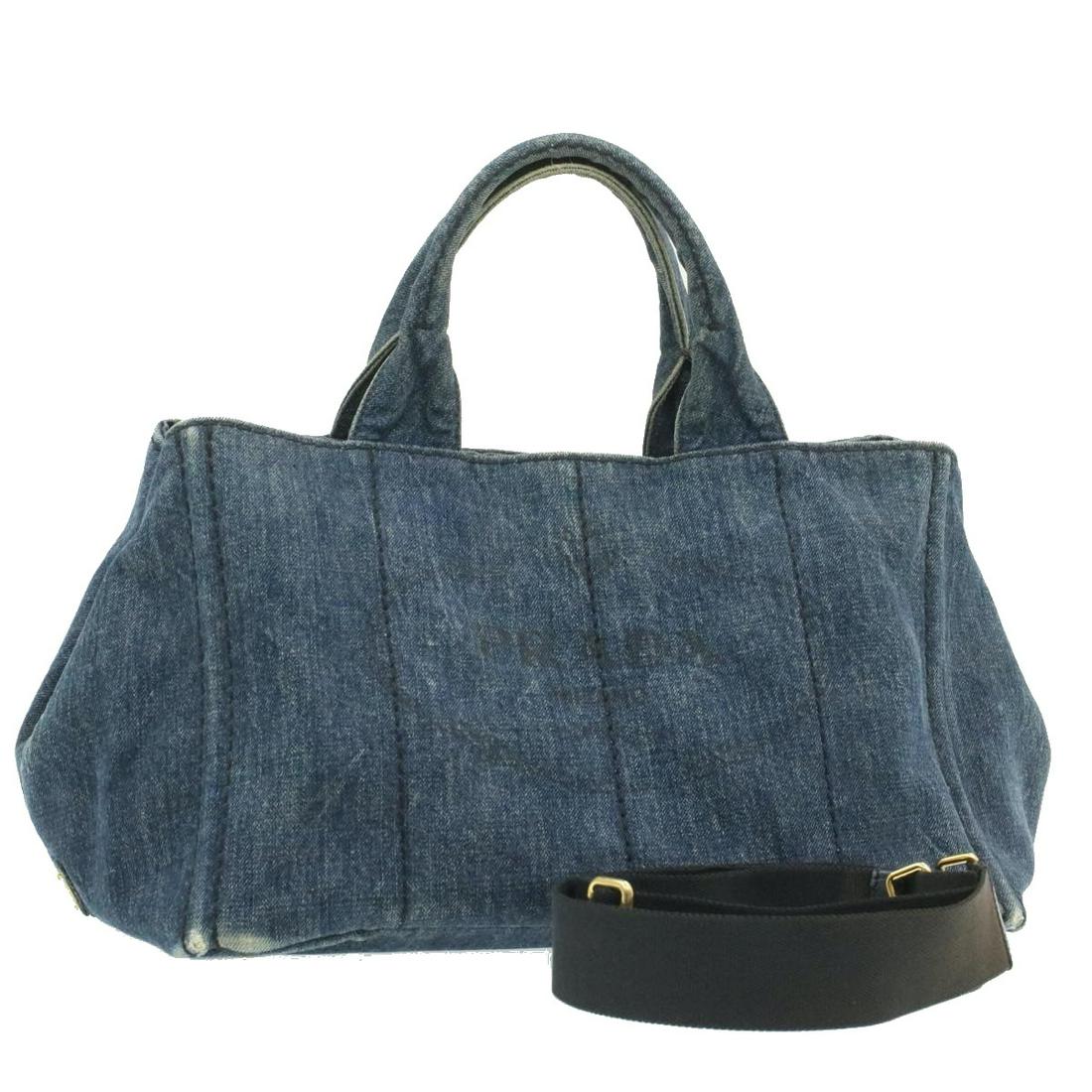 Authentic PRADA Canvas Hand Bag: Brand: PRADA Material: Canvas Style: Hand Bag Color: Blue Size(inch): W14.17 x H9.05 x D9.05inch / Strap Total Length 27.55-47.24inch(Approx) Country of Origin: Italy Accessory: Shoulder Strap