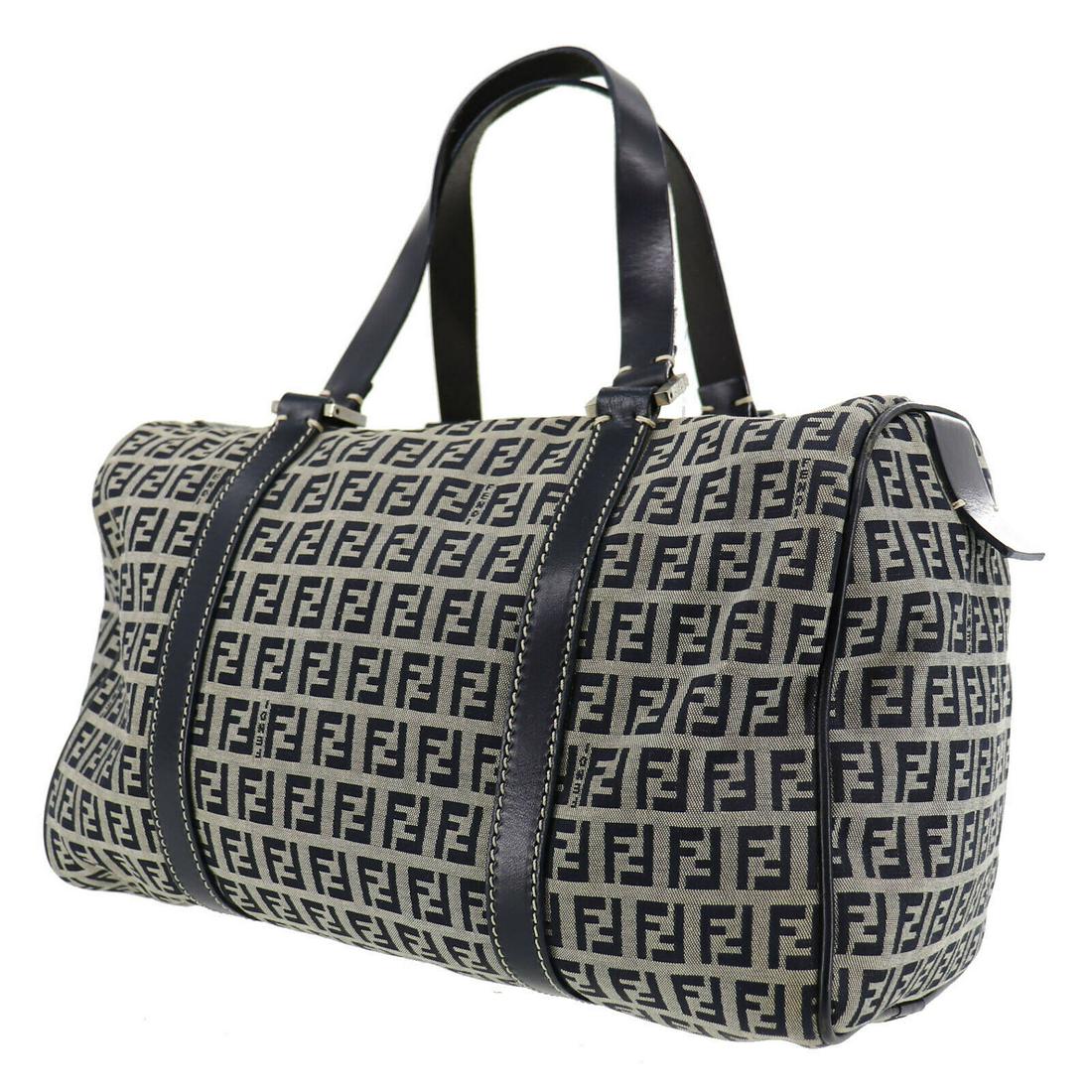 Authentic FENDI Hand Bag: Brand: FENDI Model: Hand Bag Country of Origin: Italy Material: Satin Color: Silver Bag Length: 12.9 Bag Height: 7.8 Bag Depth: 6.2 All Bidhaus items come with a 100 % money-back authenticity guarante