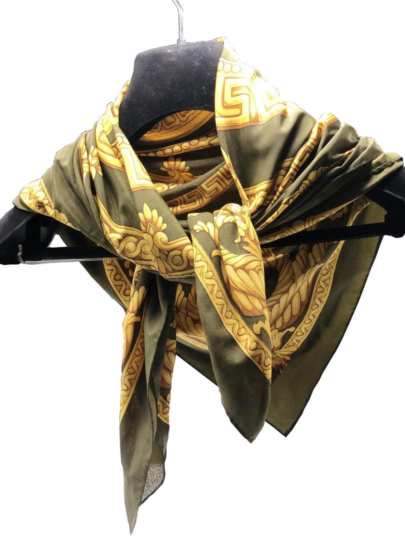 Authentic Versace 'Gianni' Scarf: Brand: VersaceMaterial: SilkStyle: ScarfColor: GoldSize(inch): 32 x 32Country of Origin: ItalyAll Bidhaus items come with a 100% money-back authenticity guarantee. ALL SALES ARE FINAL. Please refer to
