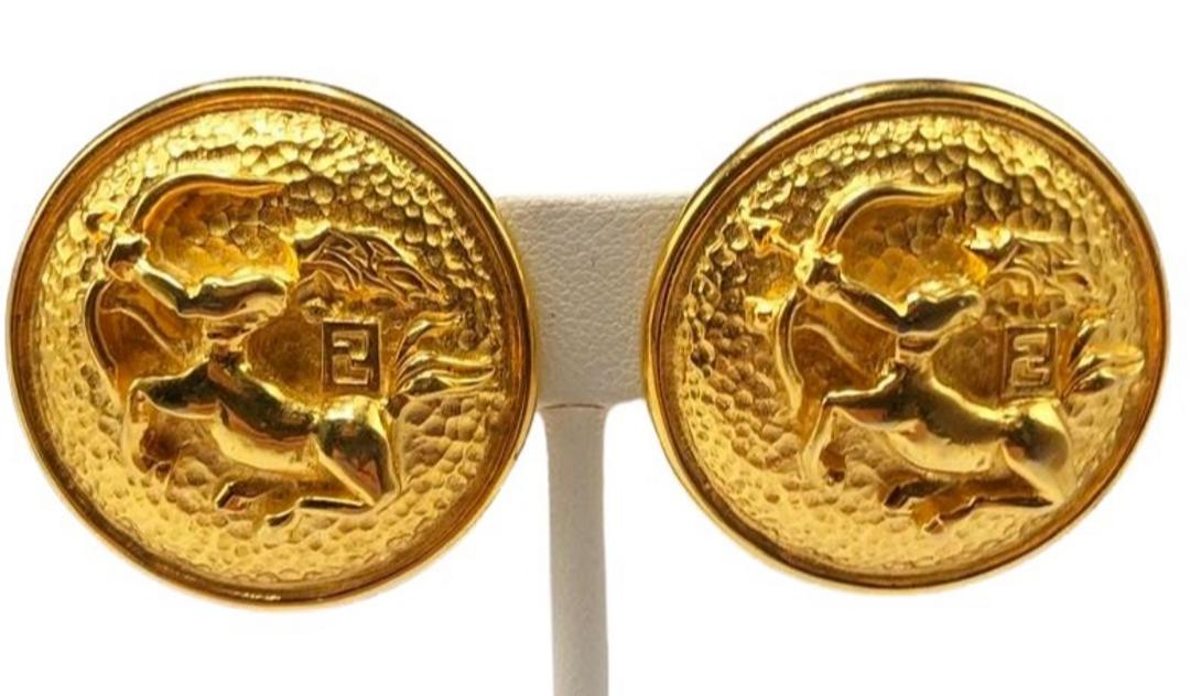 Authentic Fendi Sagittarius Archer Dome Coin Earrings: Brand: Style: Hallmark:: Fastening: Category: Earrings Materials: Size: Other Remarks: All Bidhaus items come with a 100% money-back authenticity guarantee. ALL SALES ARE FINAL. Please refer to images