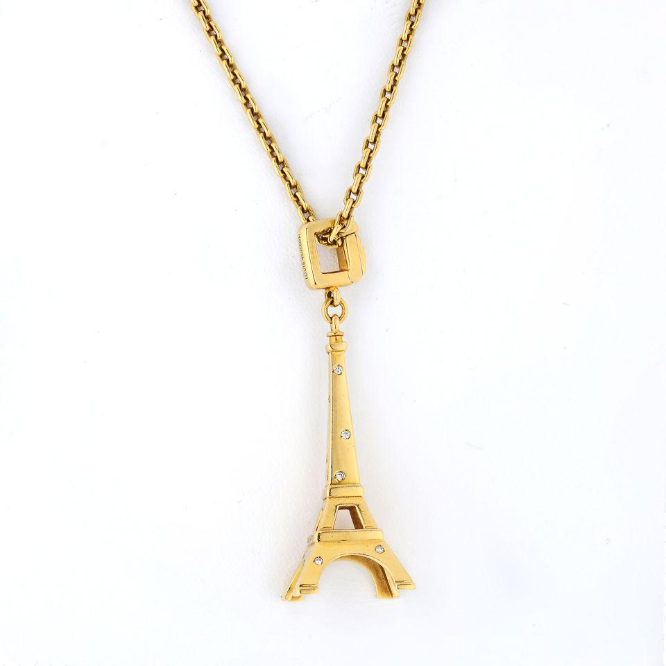 Authentic Louis Vitton 18K Yellow Gold Eiffel Tower: Type: Pendants Brand: Louis Vitton Metal: 18K Yellow Gold Grams: 26.2 Other Details: Elite and authentic from Louis Vuitton this gorgeous charm or pendant on an original chain is crafted from 18k yell