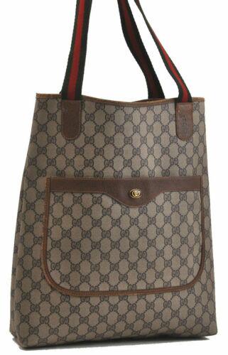 Authentic GUCCI Tote Bag: Brand: GUCCI Model: Tote Bag Country of Origin: Italy Material: PVC Color: Brown Bag Length: 11.8inches (30cm) Bag Height: 14.4inches (36.5cm) Bag Depth: 3.1inches (8cm) All Bidhaus items come with a 
