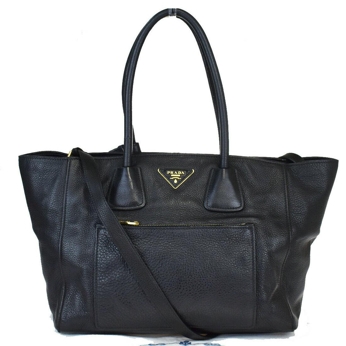 Authentic PRADA Top Handle: Brand: PRADA Model: Top Handle Country of Origin: Italy Material: Leather Color: Black Size (Inch): W12.2X H9.4X D7.5"Size (CM): W31X H24X D19Cm All Bidhaus items come with a 100 % money-back authenti