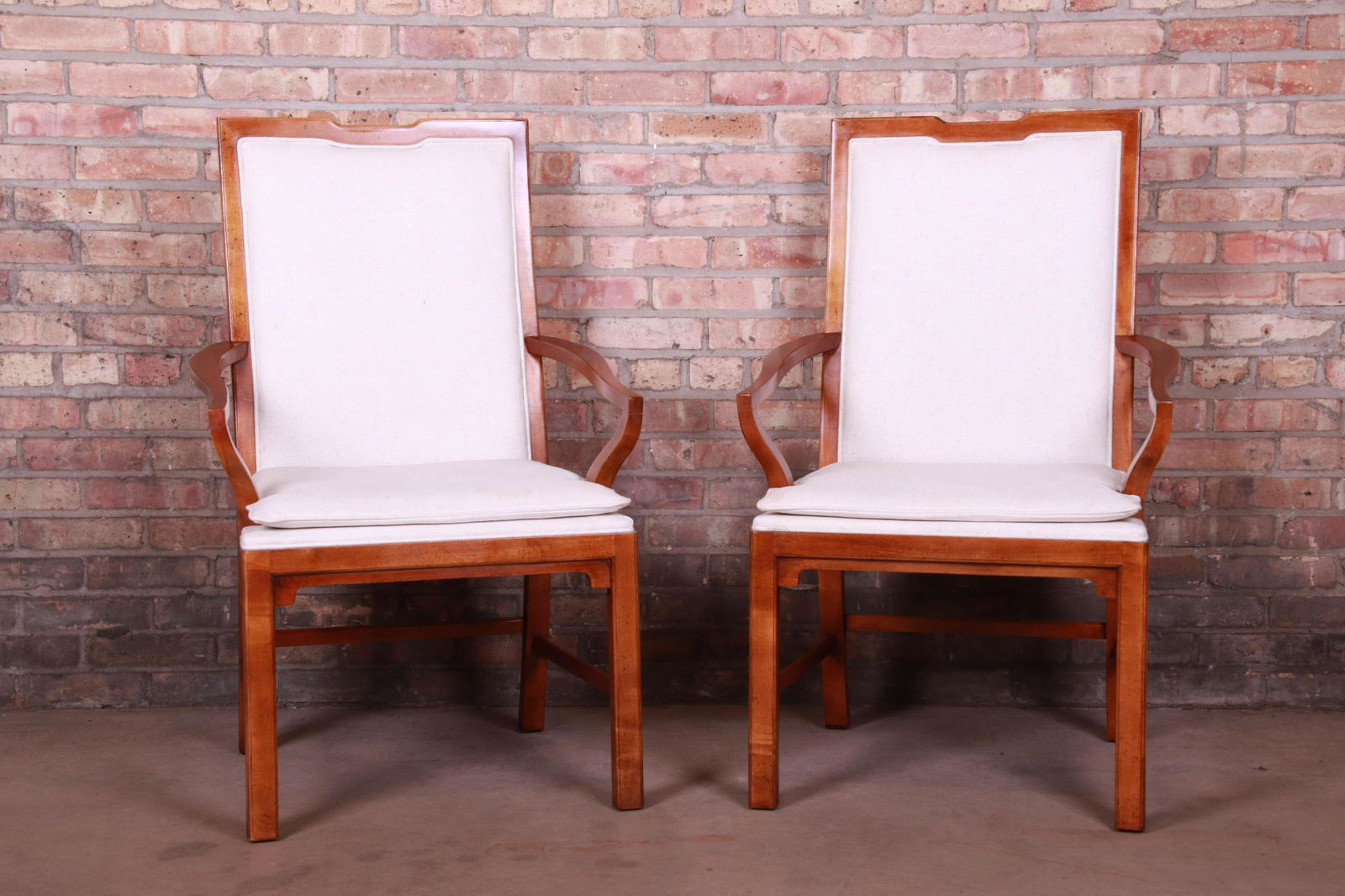 Michael Taylor for Baker Far East Collection Walnut: An exceptional pair of mid-century Hollywood Regency Chinoiserie armchairs By Michael Taylor for Baker Furniture "Far East Collection" USA Circa 1960s Solid walnut with ivory upholstery. Measures: 24.