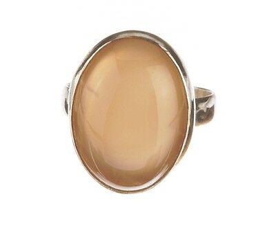 Sterling Silver Peach Moonstone Cabochon Ring: Greatclassic design with a massive stone. Circa 1970's. Oval cabochon measures 18 mm's by 14 mm's. Ring setting is sterling silver. Ring is a size 7. The ring weighs 5.9 grams. Marked "925" for sterli