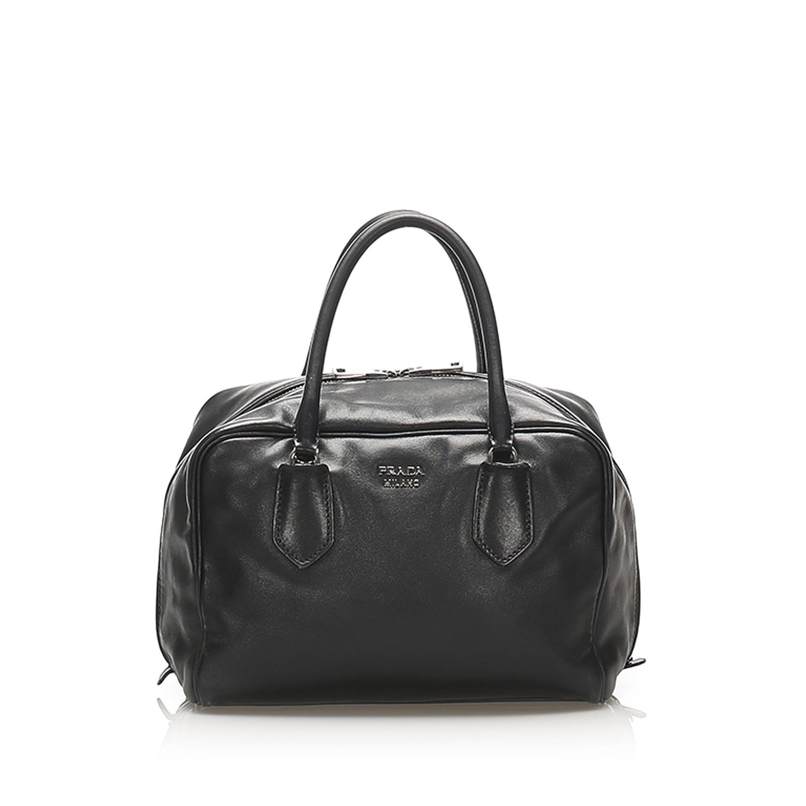Authentic Prada Vitello Daino Handbag: This handbag features a leather body rolled leather handles an top zip closure and an interior zip compartments. Brand: Prada Model: Vitello Daino Handbag Origin: Italy Category: Bags Color: Black Sty