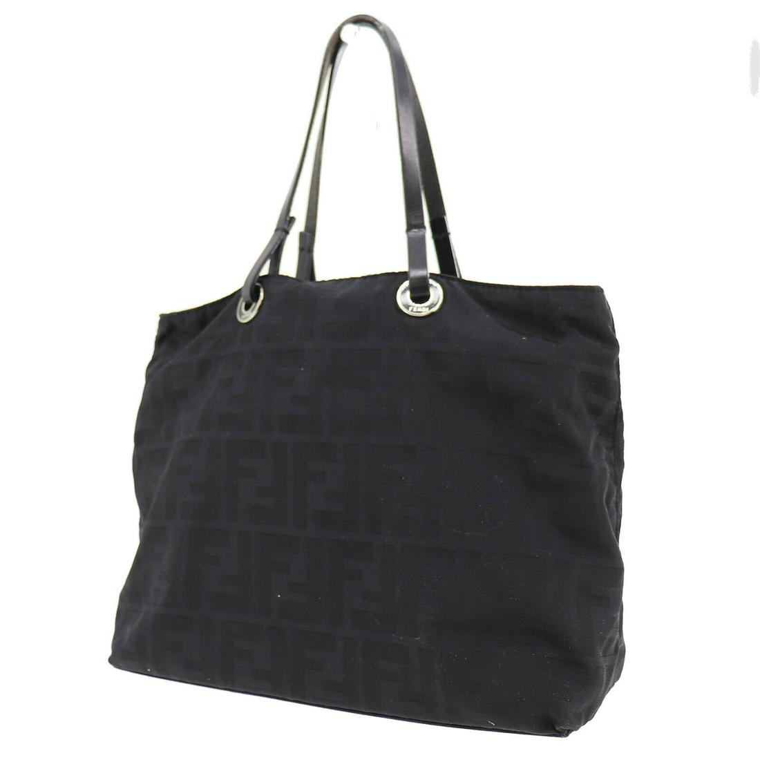 Authentic FENDI Tote Hand Bag: Brand: FENDI Model: Tote Hand Bag Country of Origin: Italy Material: Nylon Color: Silver Bag Length: 9.8 Bag Height: 7.8 Bag Depth: 3.9 All Bidhaus items come with a 100 % money-back authenticity guar