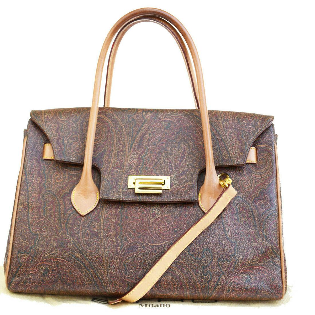 Authentic ETRO Shoulder Hand Bag: Brand: ETRO Model: Shoulder Hand Bag Country of Origin: Italy Material: PVC Leather Color: Bordeaux Size (Inch): W12.2X H8.3X D5.9"Size (CM): W31X H21X D15Cm All Bidhaus items come with a 100 % money-