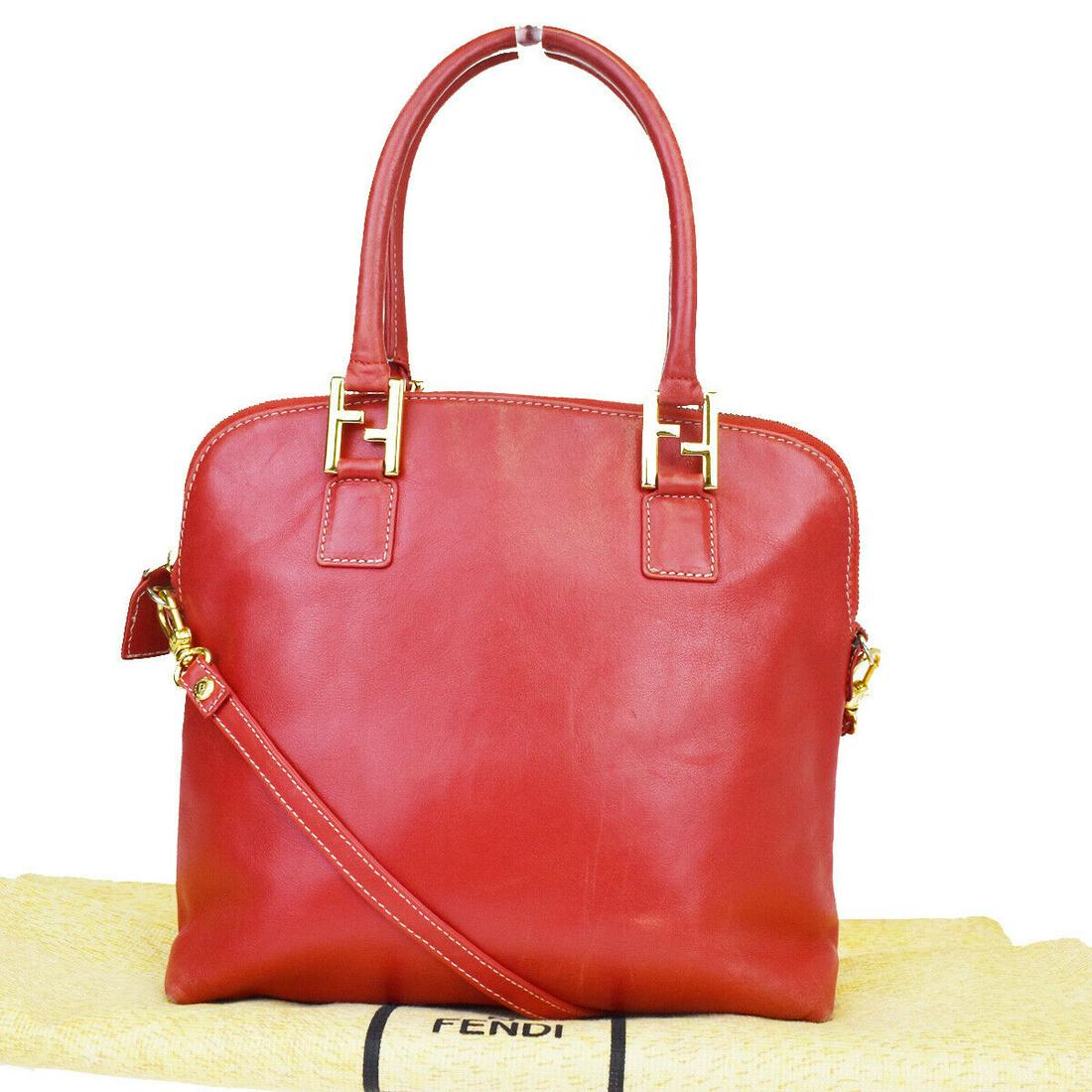 Authentic FENDI Hand Bag: Brand: FENDI Model: Hand Bag Country of Origin: Material: Leather Color: Red Size (Inch): W9.8X H9.1X D4.3"Size (CM): W25X H23X D11Cm All Bidhaus items come with a 100 % money-back authenticity guaran