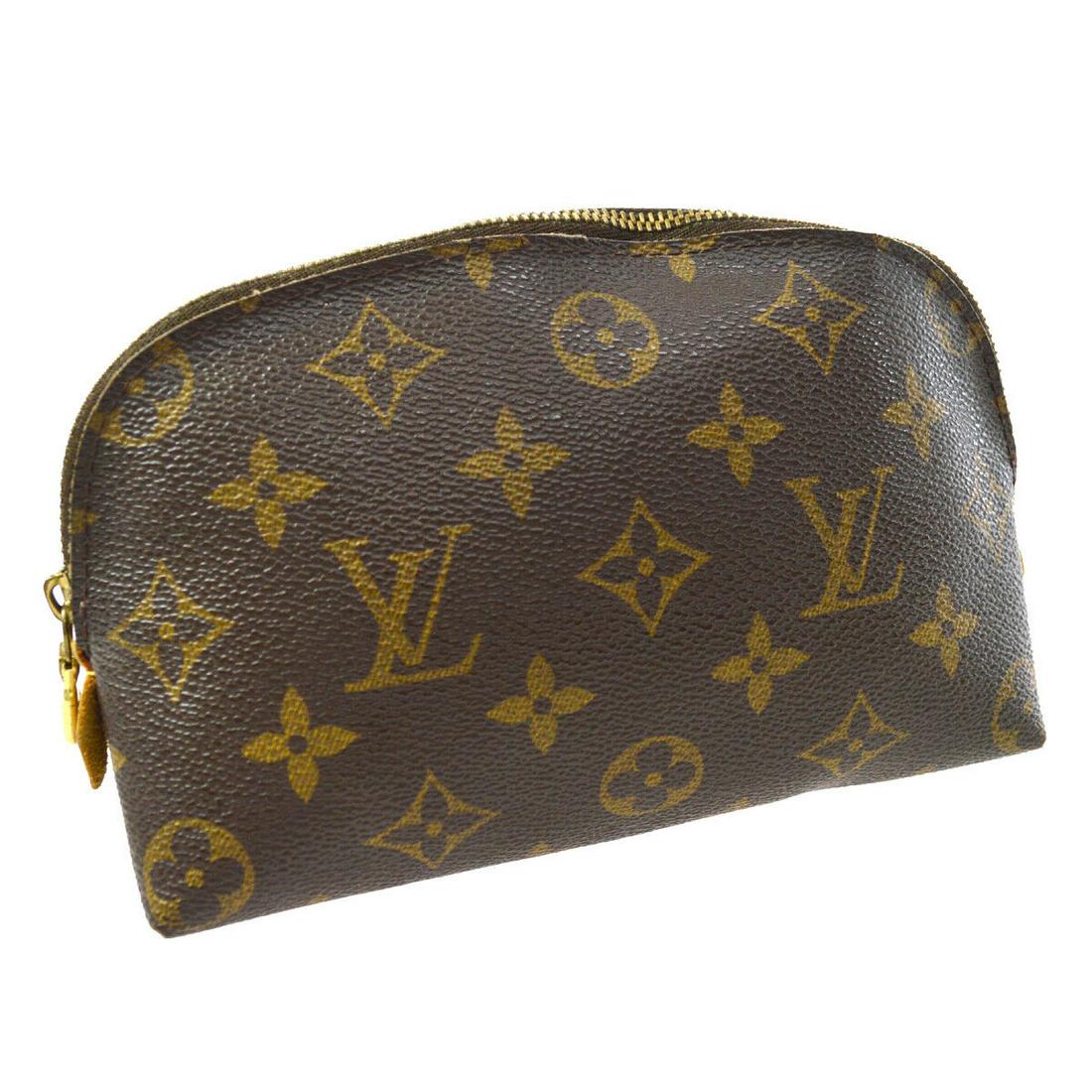 Authentic LOUIS VUITTON Monogram Cosmetic Pouch: Brand: LOUIS VUITTON Model: Monogram Cosmetic Pouch Country of Origin: Spain Material: Leather Color: Brown Size (Inch): W 6.5 x H 4.7 x D 2.4 " Size (CM): W 16.5 x H 12.0 x D 6.0 cm All Bidhaus items