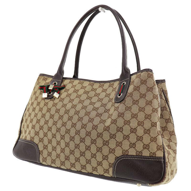Authentic GUCCI Hand Bag: Brand: GUCCI Model: Hand Bag Country of Origin: Italy Material: Canvas Color: Gold Bag Length: 17.3 Bag Height: 10.2 Bag Depth: 4.9 All Bidhaus items come with a 100 % money-back authenticity guarante