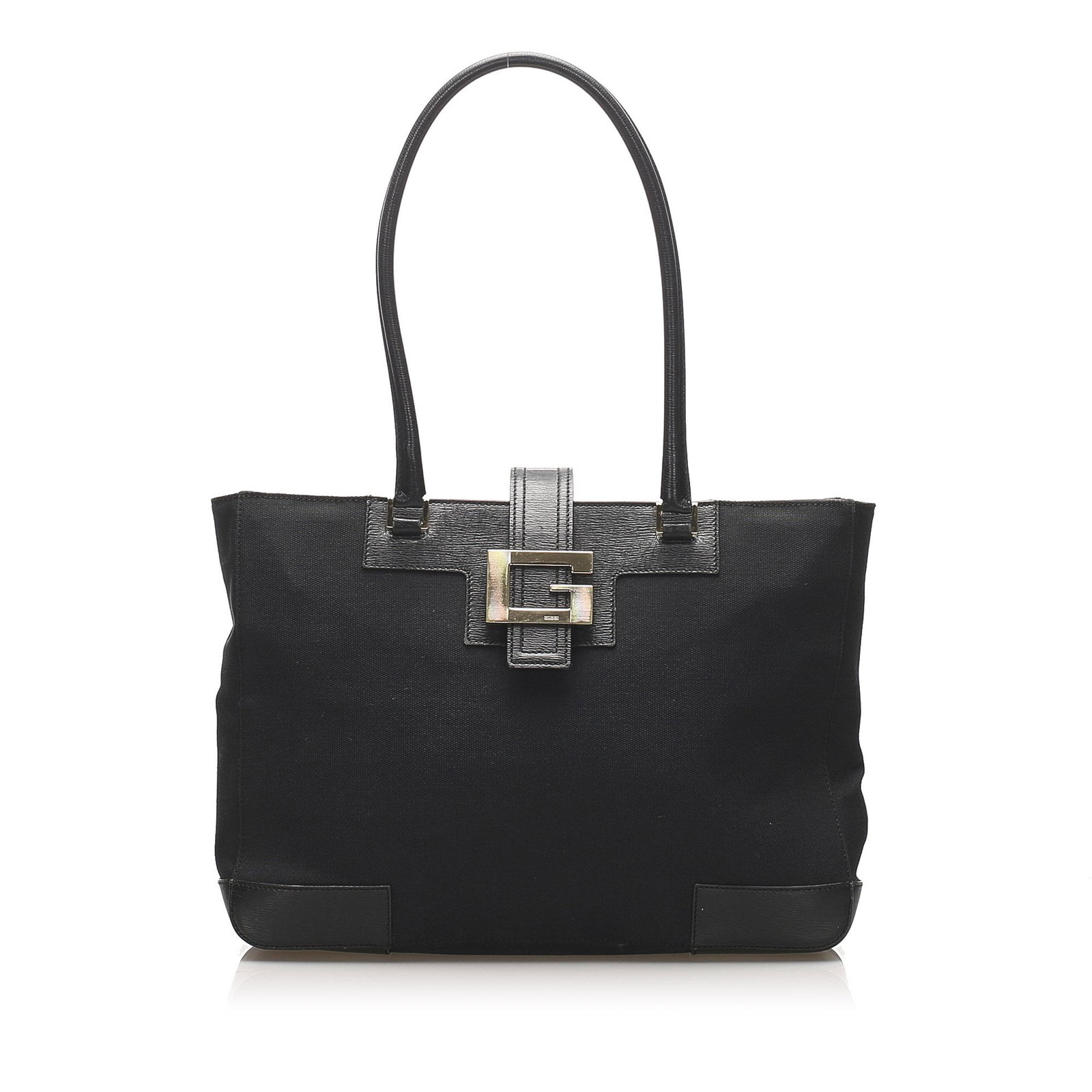 Authentic Gucci Canvas Shoulder Bag: This shoulder bag features a canvas body with leather trim rolled leather handles a top strap with snap button closure and interior zip pockets. Brand: Gucci Model: Canvas Shoulder Bag Origin: Italy C
