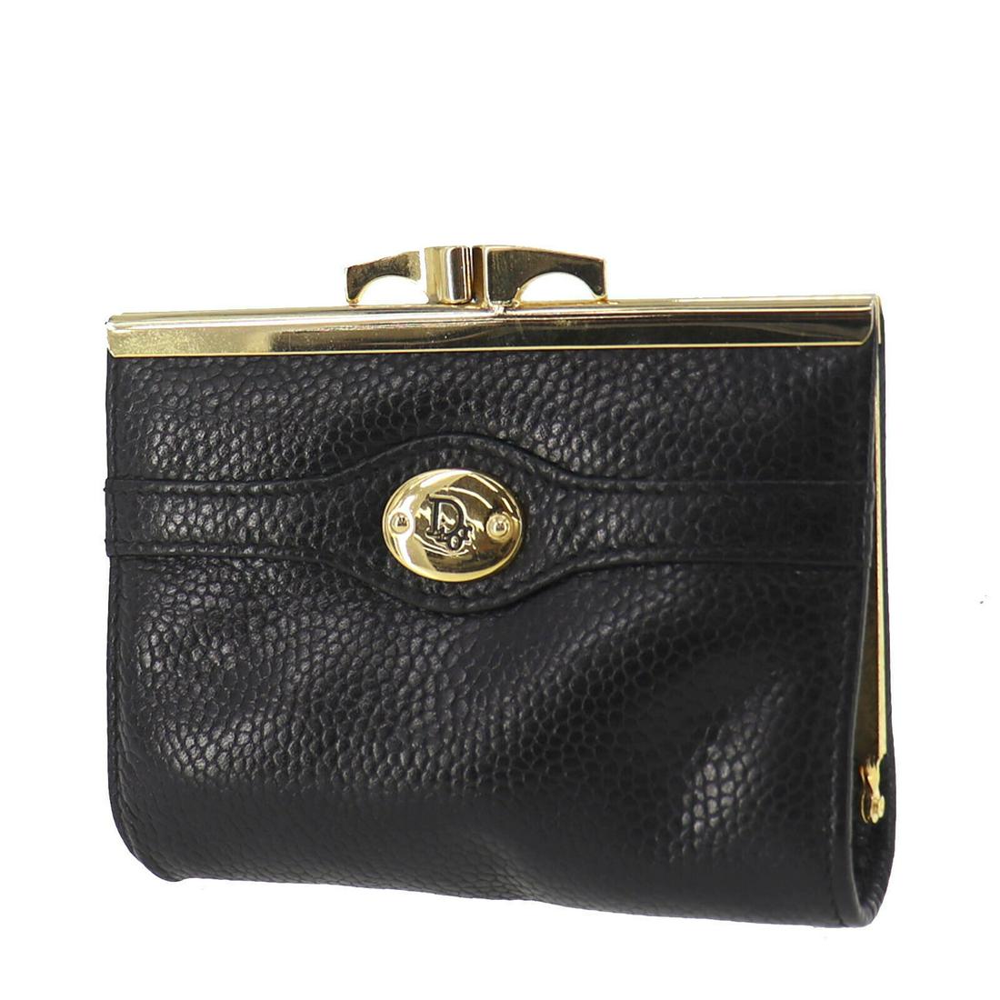 Authentic CHRISTIAN DIOR Coin Purse: Brand: CHRISTIAN DIOR Model: Coin Purse Country of Origin: Spain Material: Embossed Leather Color: Black All Bidhaus items come with a 100 % money-back authenticity guarantee. ALL SALES ARE FINAL. Ple