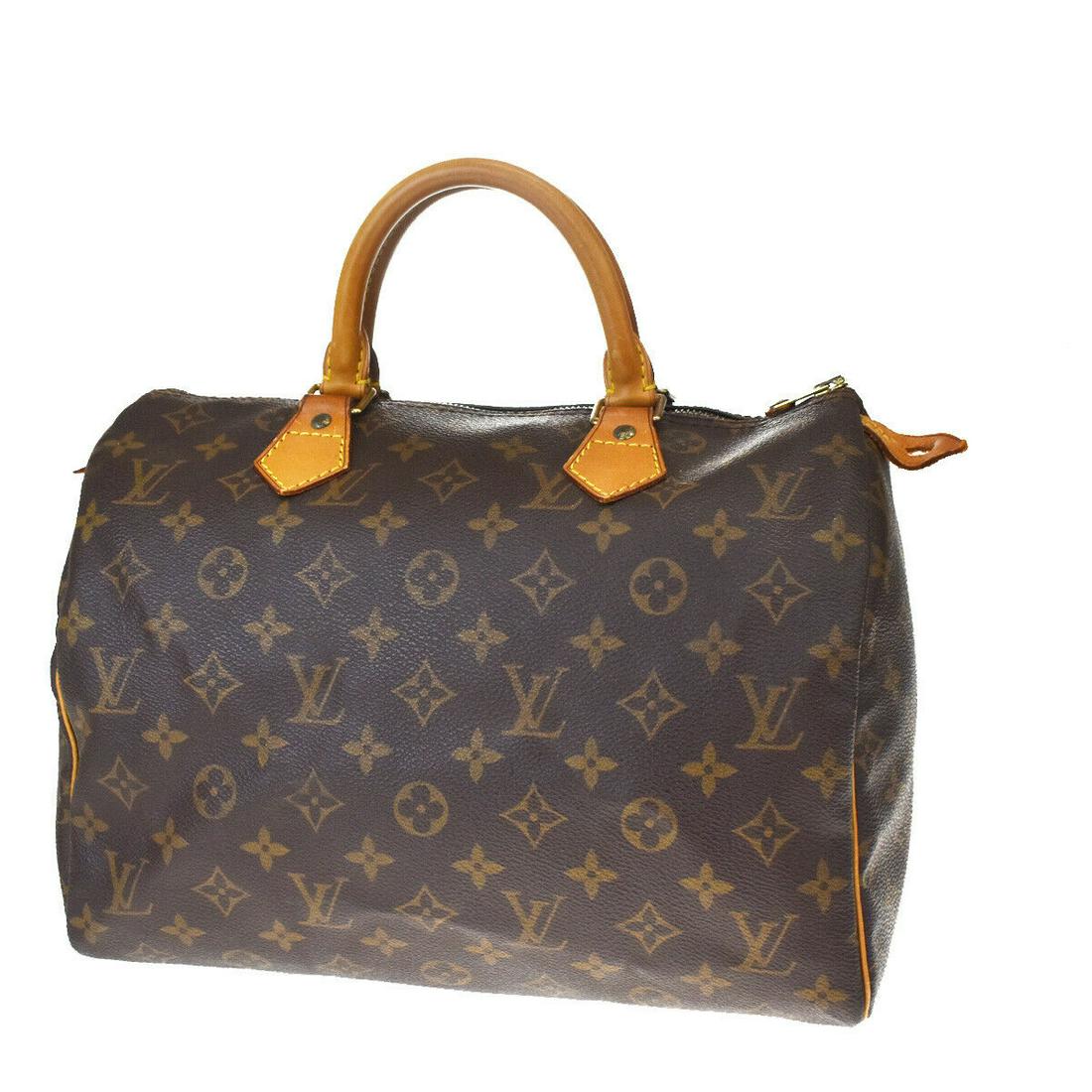 Authentic LOUIS VUITTON Speedy 30 Hand Bag: Brand: LOUIS VUITTON Model: Speedy 30 Hand Bag Country of Origin: France Material: Canvas Color: Brown Size (Inch): W 11.8 X H 8.3 X D 6.7 "Size (CM): W 30 X H 21 X D 17 Cm All Bidhaus items come with