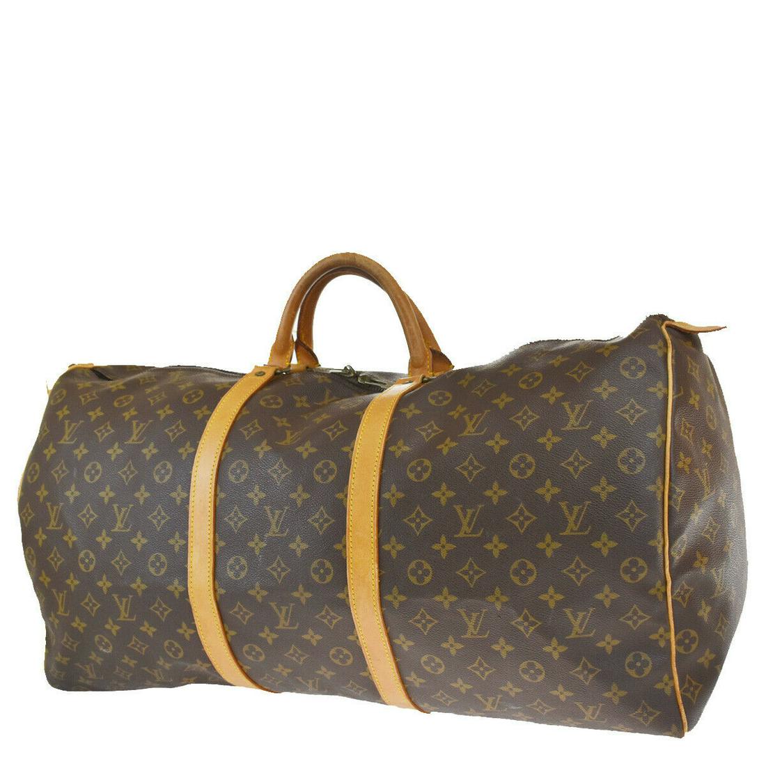 Authentic LOUIS VUITTON Keepall 50 Top Handle: Brand: LOUIS VUITTON Model: Keepall 50 Top Handle Country of Origin: France Material: Canvas Color: Brown Size (Inch): W 23.6 X H 12.6 X D 9.8 "Size (CM): W 60 X H 32 X D 25 Cm All Bidhaus items come 