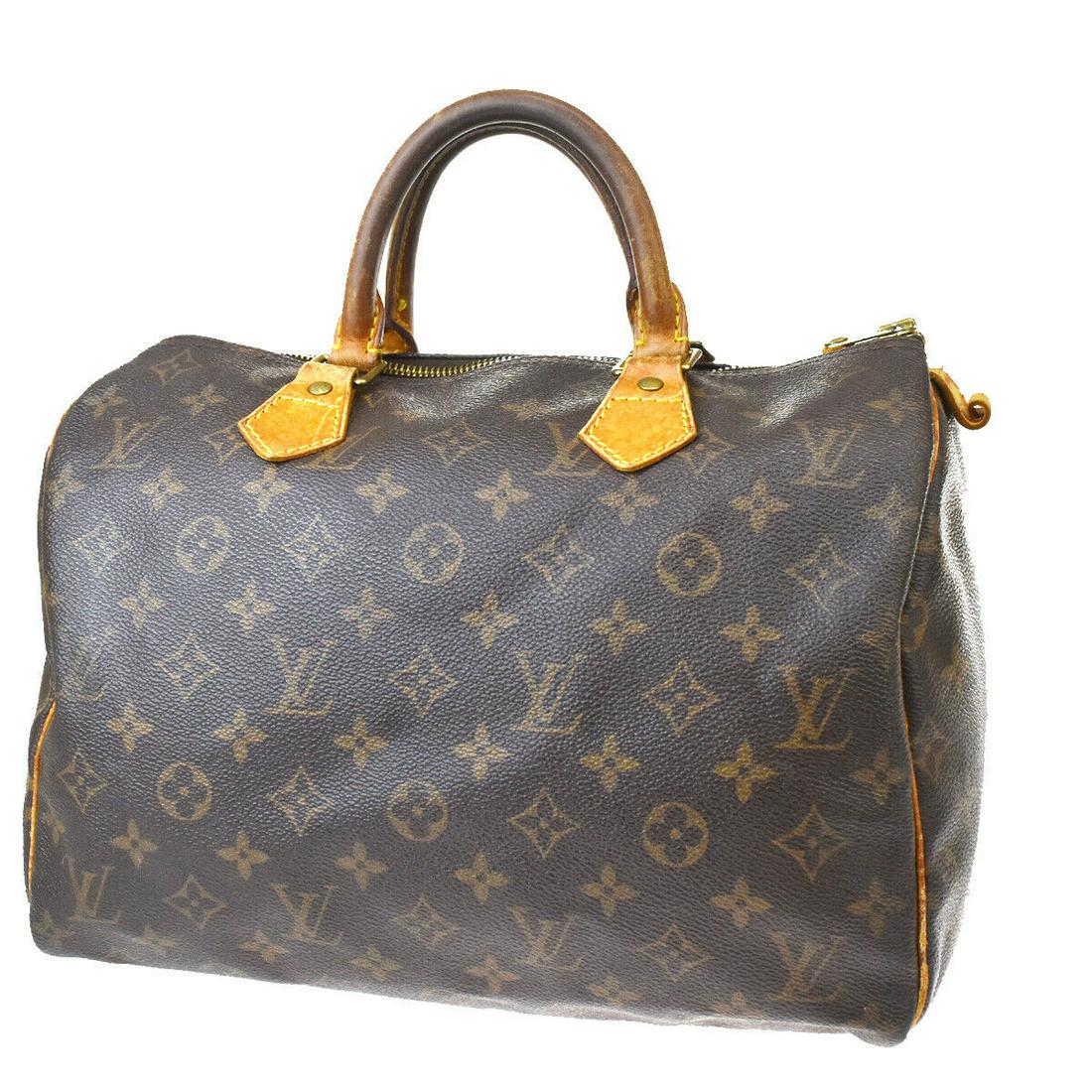 Authentic LOUIS VUITTON Speedy 30 Hand Bag: Brand: LOUIS VUITTON Model: Speedy 30 Hand Bag Country of Origin: France Material: Canvas Color: Brown Size (Inch): W 11.8 X H 8.3 X D 6.7 "Size (CM): W 30 X H 21 X D 17 Cm All Bidhaus items come with