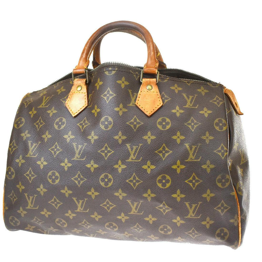 Authentic LOUIS VUITTON Speedy 35 Double Handles: Brand: LOUIS VUITTON Model: Speedy 35 Double Handles Country of Origin: France Material: Canvas Color: Brown Size (Inch): W 13.8 X H 9.4 X D 7.1"Size (CM): W 35 X H 24 X D 18 Cm All Bidhaus items come