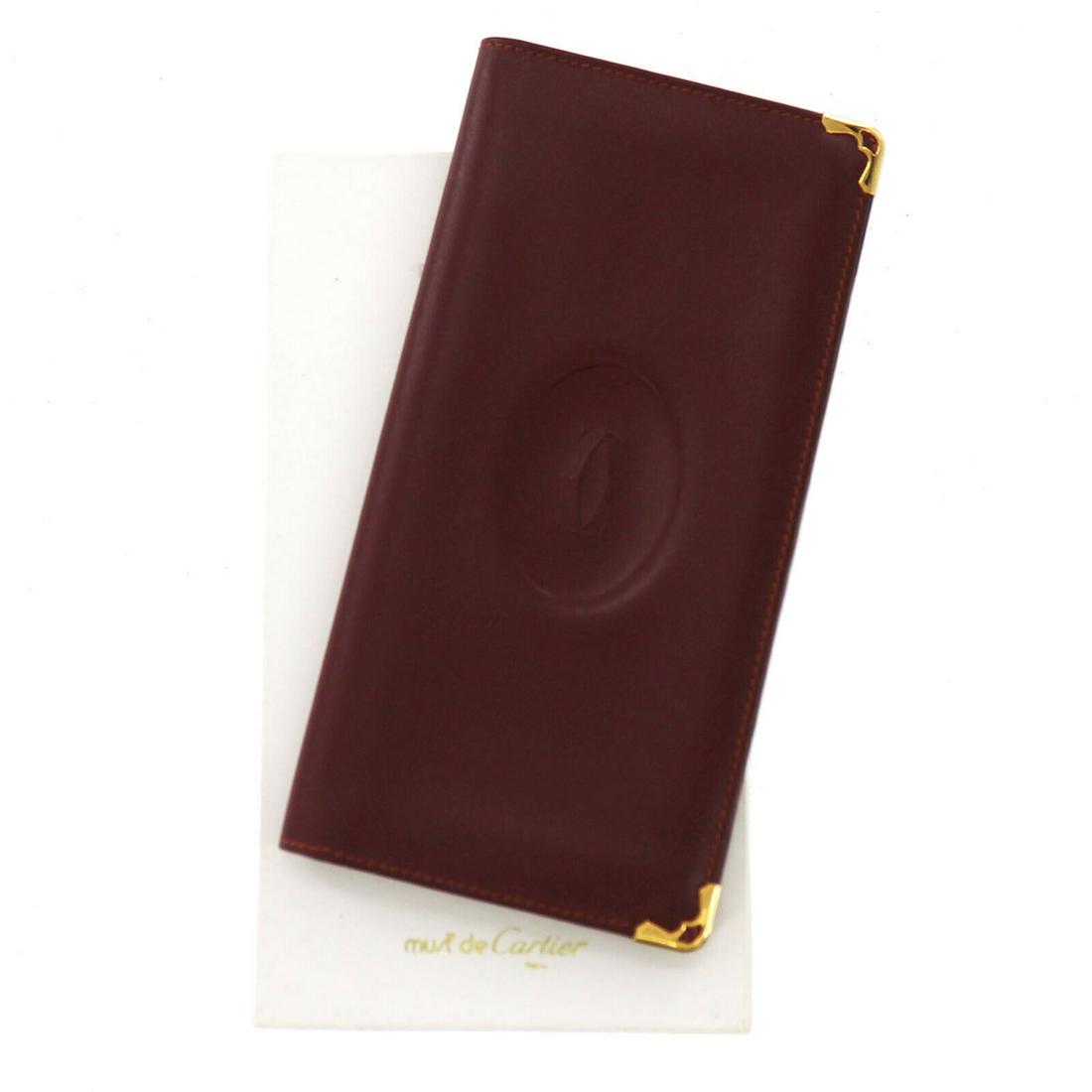 Authentic CARTIER Card Wallet: Brand: CARTIER Model: Card Wallet Country of Origin: Material: Leather Color: Bordeaux All Bidhaus items come with a 100 % money-back authenticity guarantee. ALL SALES ARE FINAL. Please refer to image