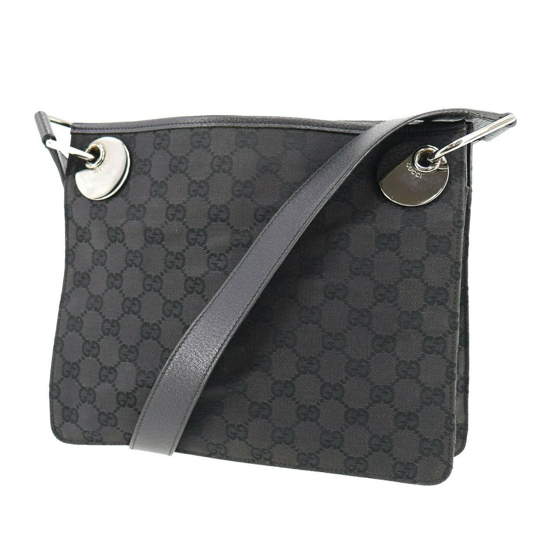 Authentic GUCCI Shoulder Bag: Brand: GUCCI Model: Shoulder Bag Country of Origin: Italy Material: Canvas Color: Black Silver Bag Length: 10.8 Bag Height: 8.8 Bag Depth: 2.9 All Bidhaus items come with a 100 % money-back authentici