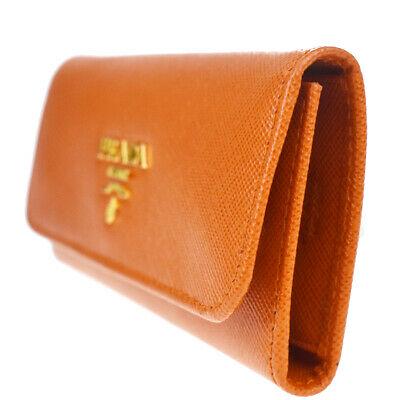 Authentic PRADA Key Case: Brand: PRADA Model: Key Case Country of Origin: Italy Material: Leather Color: Orange Size (Inch): W5.1X H2.6X D0"Size (CM): W13X H6.5X D0Cm All Bidhaus items come with a 100 % money-back authenticity
