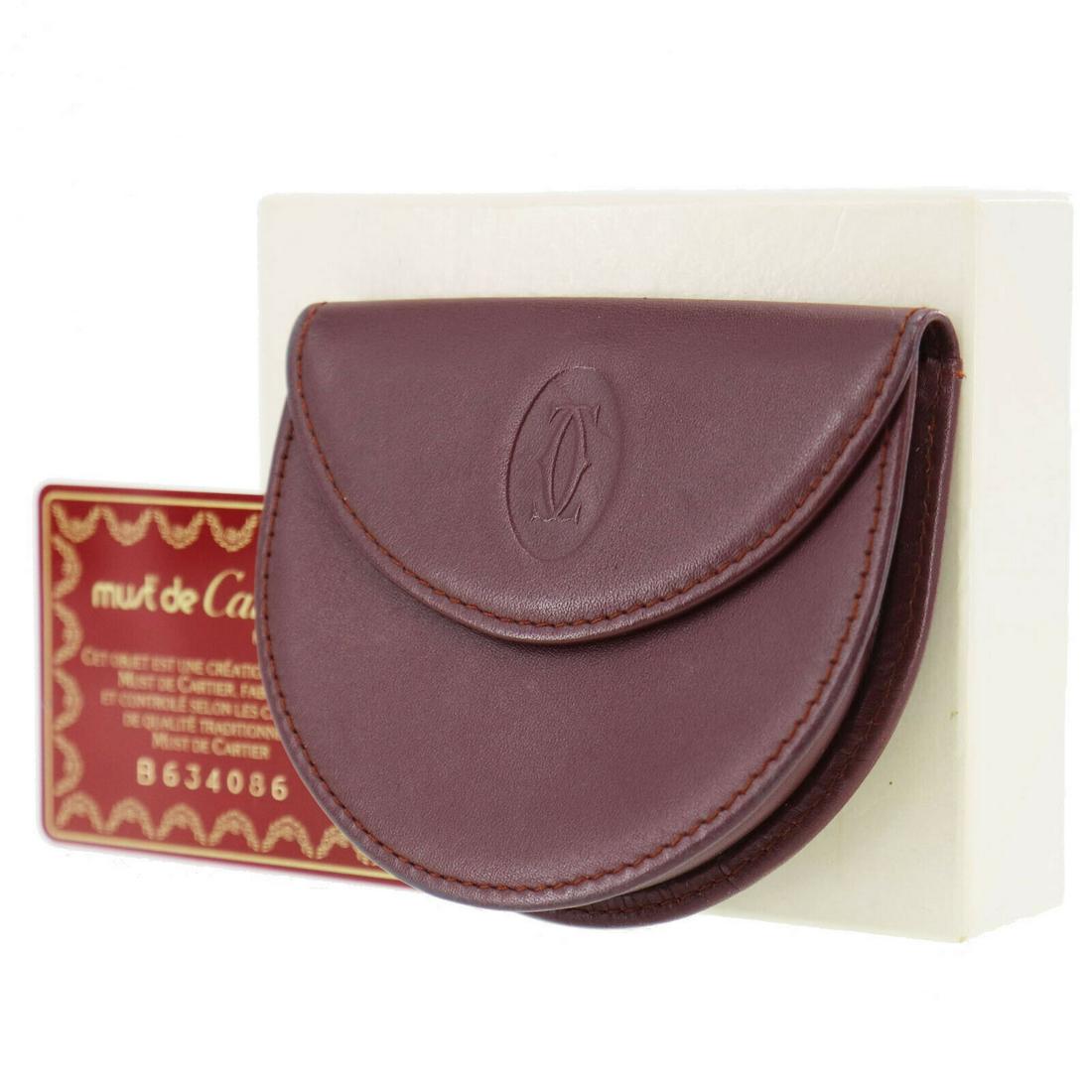 Authentic CARTIER Coin Case: Brand: CARTIER Model: Coin Case Country of Origin: Spain Material: Leather Color: Bordeaux All Bidhaus items come with a 100 % money-back authenticity guarantee. ALL SALES ARE FINAL. Please refer to i