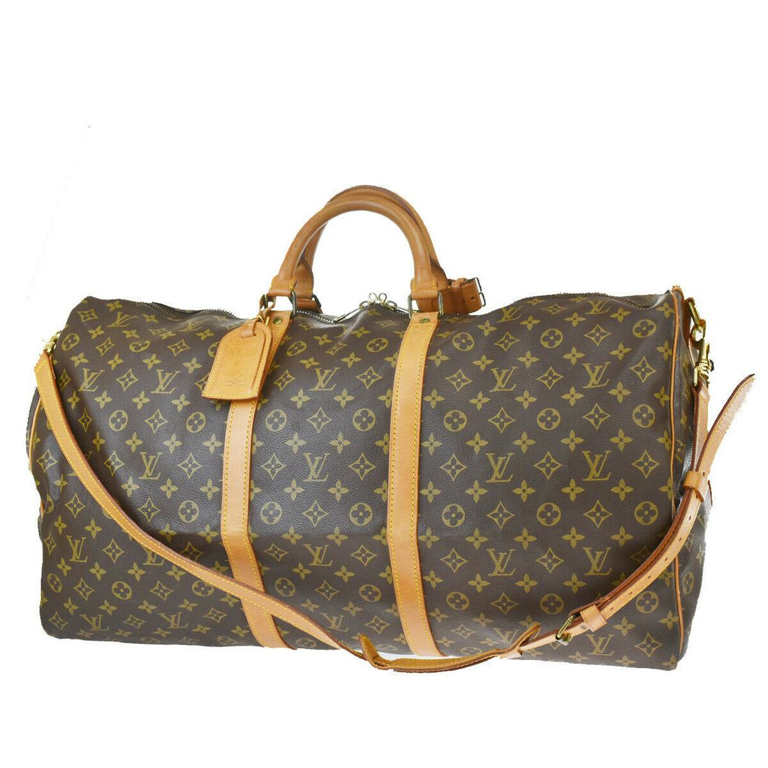 Authentic LOUIS VUITTON Keepall 60 Double Handles: Brand: LOUIS VUITTON Model: Keepall 60 Double Handles Country of Origin: France Material: Canvas Color: Brown Size (Inch): W 23.6 X H 12.6 X D 9.8 "Size (CM): W 60 X H 32 X D 25 Cm All Bidhaus items c