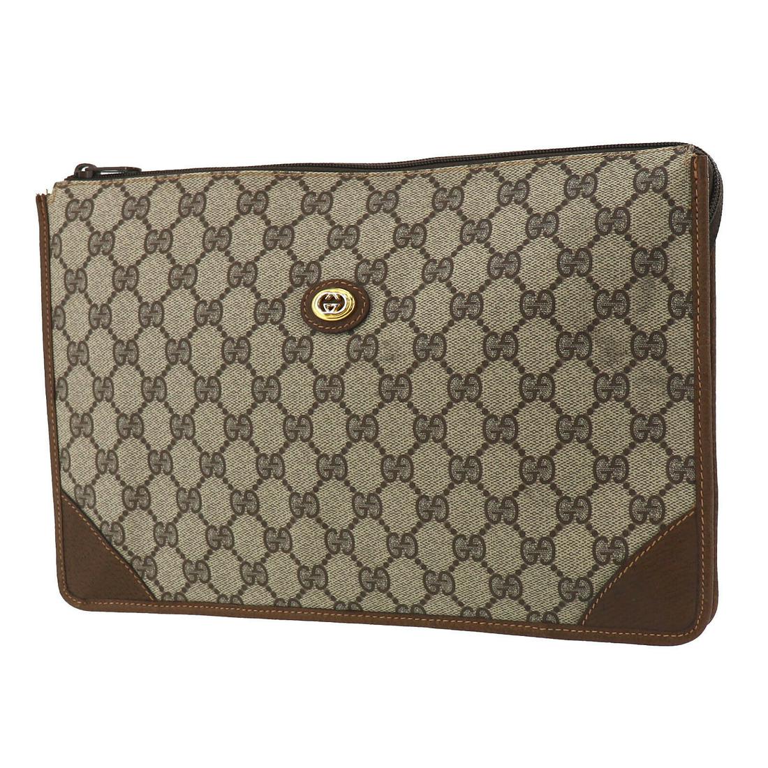 Authentic GUCCI Clutch: Brand: GUCCI Model: Clutch Country of Origin: Italy Material: Leather Color: Brown Size (inch): medium All Bidhaus items come with a 100 % money-back authenticity guarantee. ALL SALES ARE FINAL. Pleas