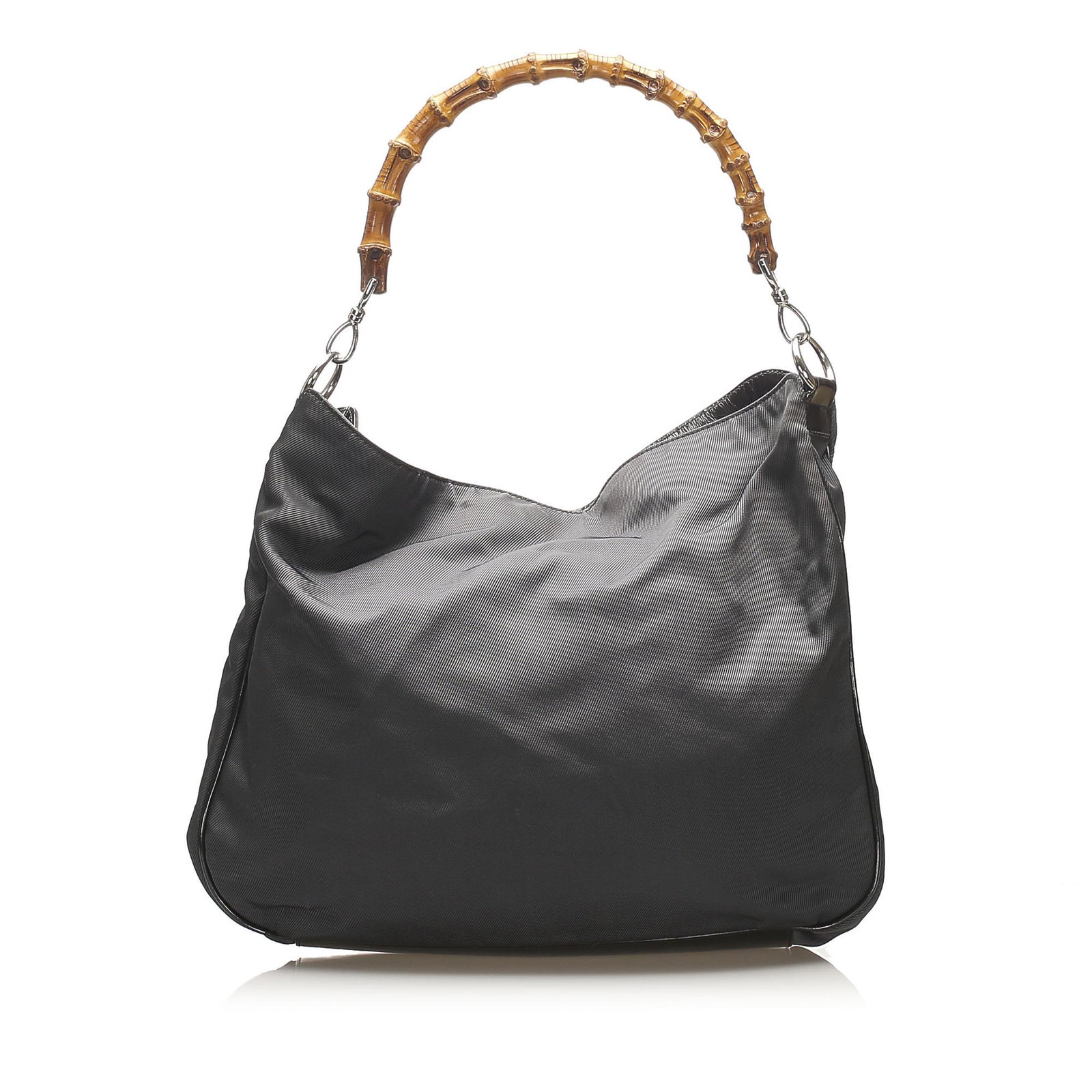 Authentic Gucci Bamboo Nylon Shoulder Bag: This shoulder bag features a nylon body with leather trim a bamboo handle an open top with magnetic closure and an interior zip pocket. Brand: Gucci Model: Bamboo Nylon Shoulder Bag Origin: Italy Cate