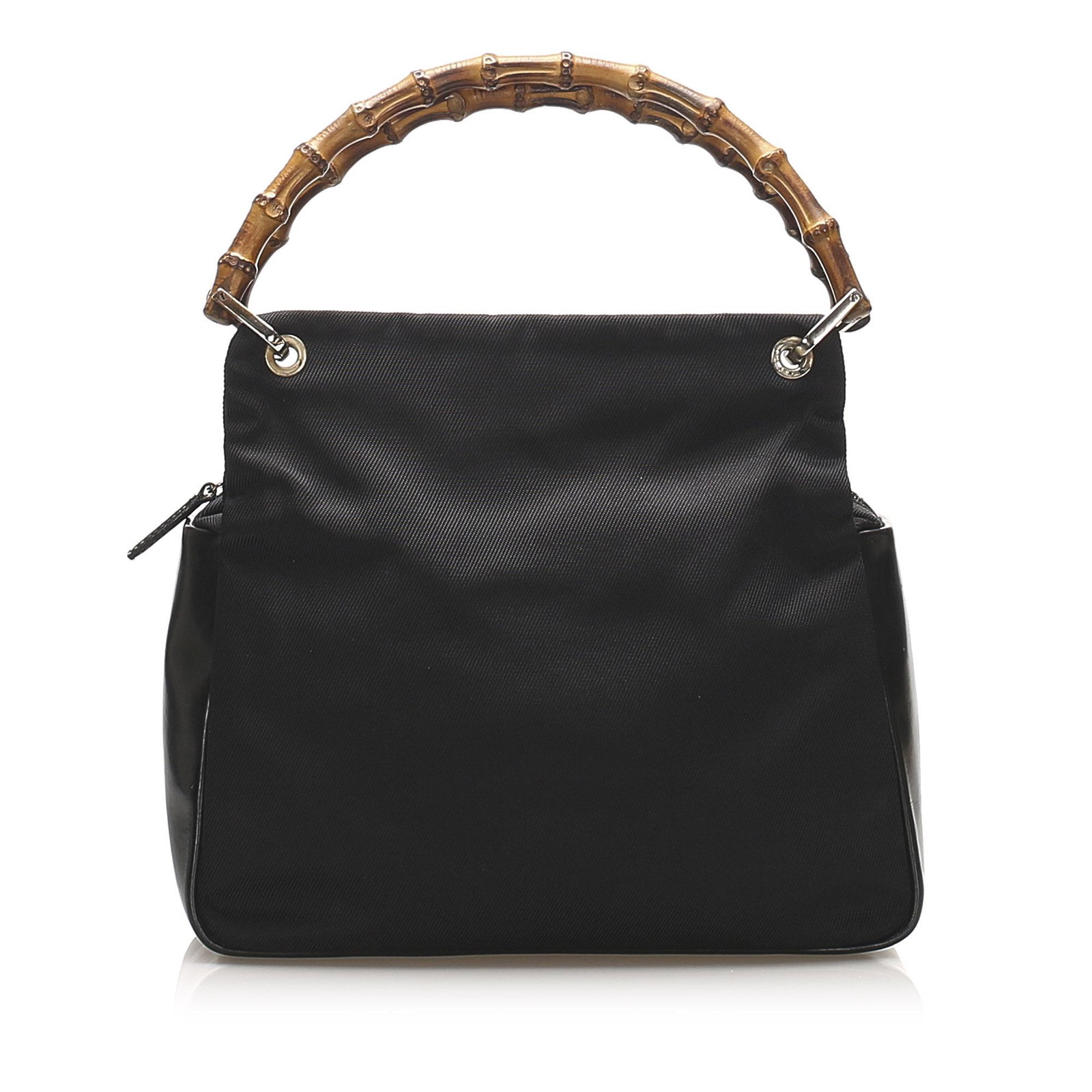 Authentic Gucci Bamboo Canvas Handbag: This handbag features a canvas body with leather trim bamboo top handles a top zip closure and an interior zip pocket. Brand: Gucci Model: Bamboo Canvas Handbag Origin: Italy Category: Handbag Color: 