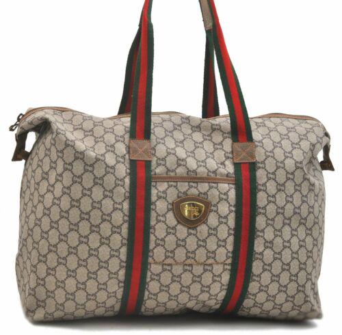Authentic GUCCI Travel Bag: Brand: GUCCI Model: Travel Bag Country of Origin: Italy Material: PVC Color: Brown Bag Length: 16.9inches (43cm) Bag Height: 13inches (33cm) Bag Depth: 6.1inches (15.5cm) All Bidhaus items come with a