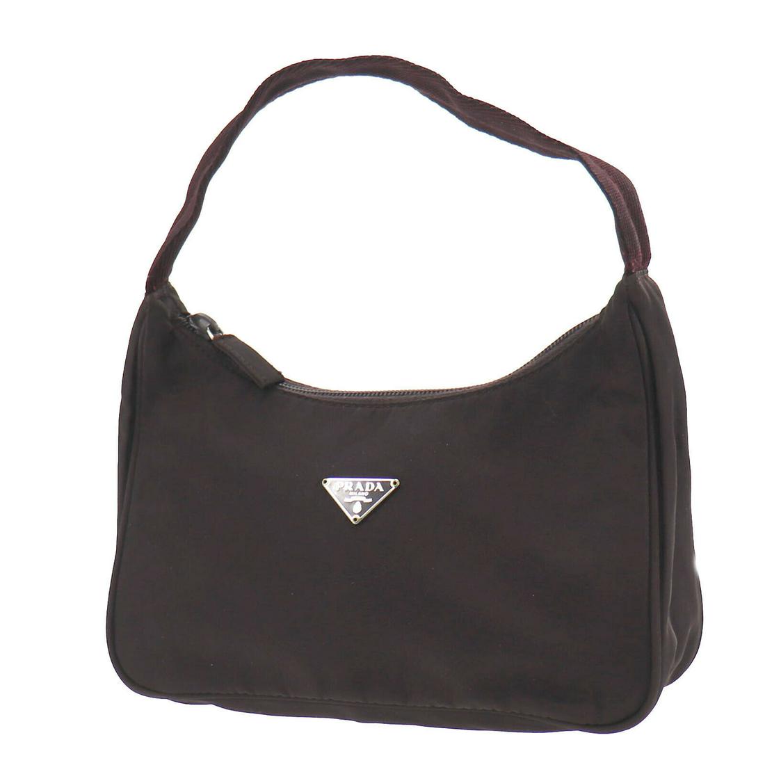 Authentic PRADA Hand Bag: Brand: PRADA Model: Hand Bag Country of Origin: Italy Material: Nylon Color: Brown Bag Length: 8.6 Bag Height: 4.7 Bag Depth: 2.3 All Bidhaus items come with a 100 % money-back authenticity guarantee.