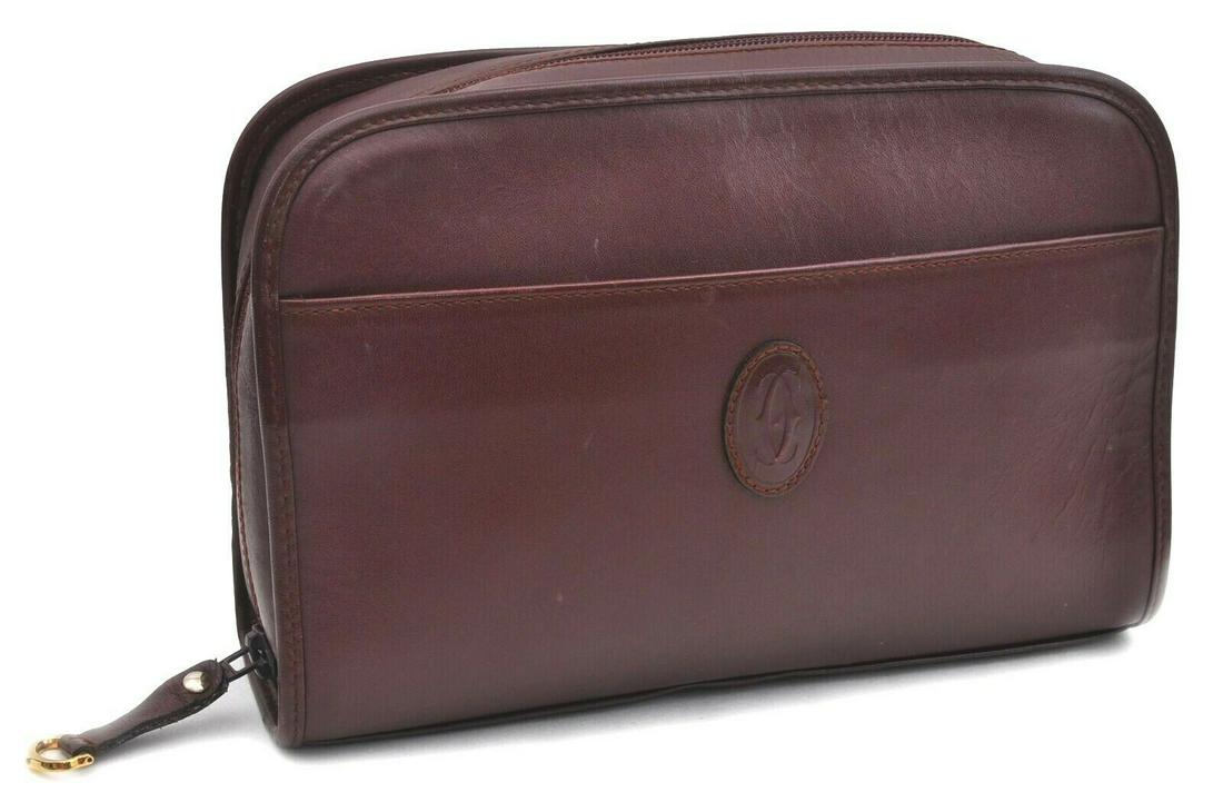 Authentic CARTIER Pouch: Brand: CARTIER Model: Pouch Country of Origin: Material: Leather Color: Bordeaux Bag Length: 9.6inches(24.5cm) Bag Height: 6.5inches(16.5cm) Bag Depth: 2.6inches(6.5cm) All Bidhaus items come with a 1