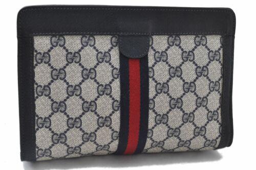 Authentic GUCCI Clutch Bag: Brand: GUCCI Model: Clutch Bag Country of Origin: Italy Material: PVC Color: Navy Bag Length: 8.9inches(22.5cm) Bag Height: 5.9inches(15cm) Bag Depth: 2.6inches(6.5cm) All Bidhaus items come with a 10