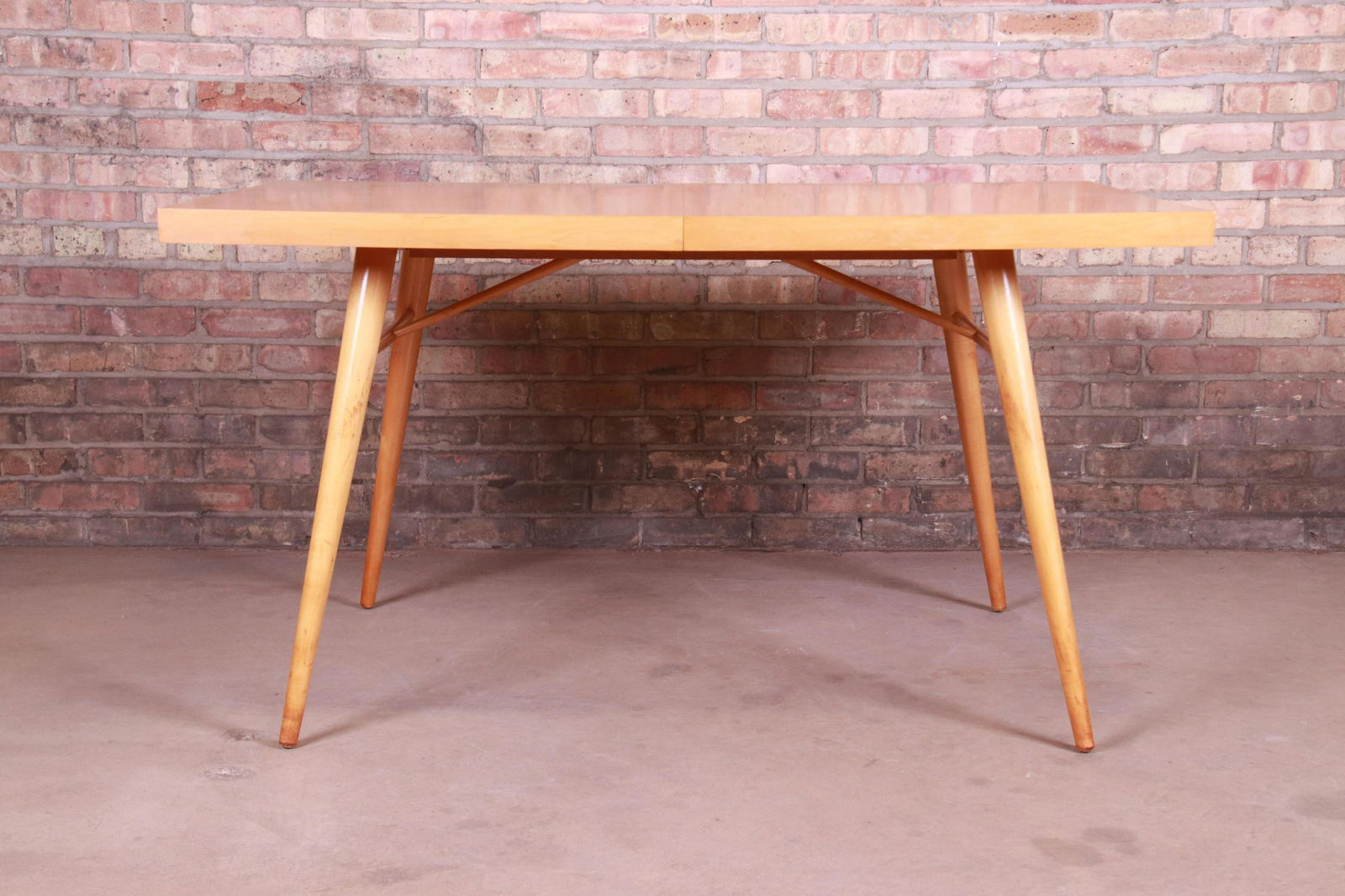 Paul McCobb Planner Group Mid-Century Modern Maple: An exceptional mid-century modern minimalist maple extension dining table By Paul McCobb for Winchendon Furniture "Planner Group" USA 1950s Measures: 54"W x 36"D x 29"H. Extends up to 84"W with two 15