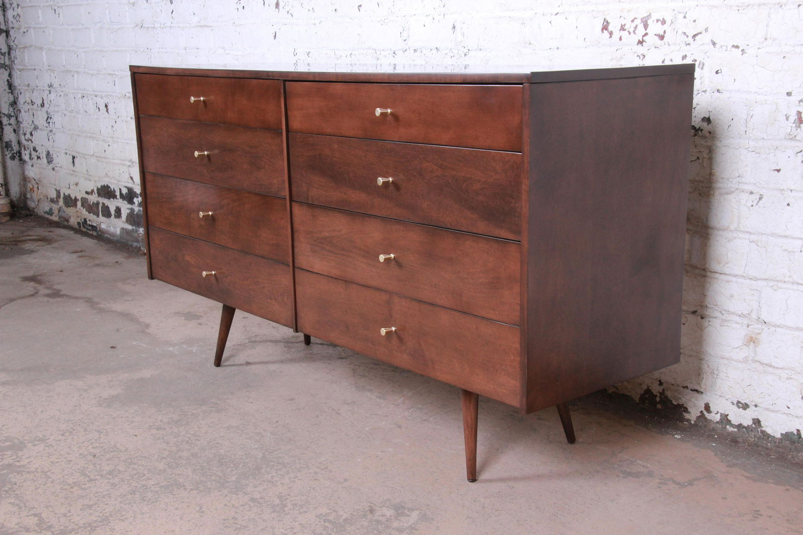 Paul McCobb Planner Group Eight-Drawer Dresser or: An exceptional mid-century modern eight-drawer dresser or credenza Designed by Paul McCobb for Winchendon Furniture "Planner Group" USA 1950s Solid birch + brass hardware Measures: 60"W x 18.25"D x 33